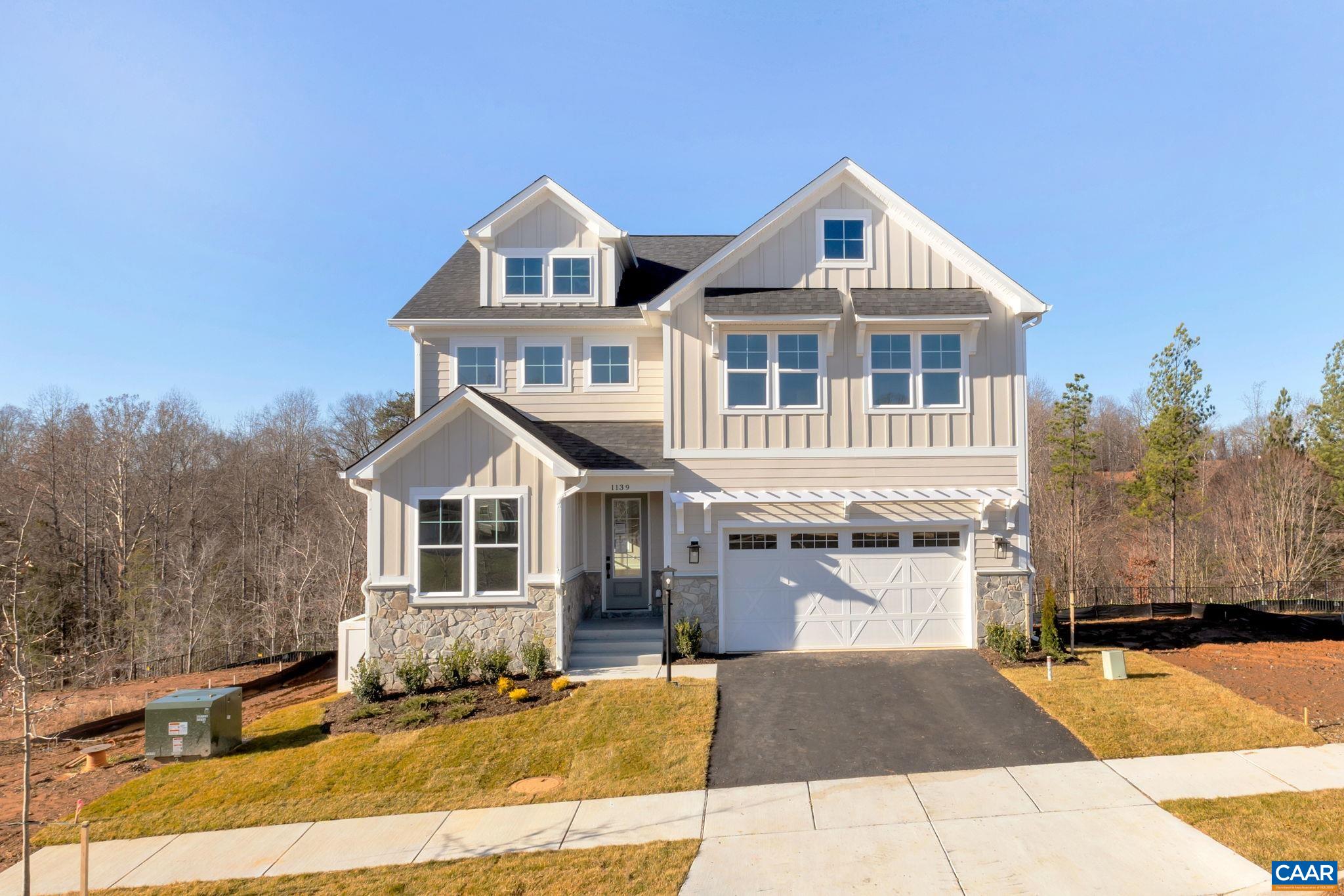 Discover modern living at The Grove at Brookhill, a brand-new neighborhood tucked among Charlottesville’s scenic woods, yet minutes from the convenience of Route 29 North. This to-be-built Aspen home on a finished walkout basement features an open-concept design that balances airy flow with cozy, purposeful spaces. The main level includes a private study, a spacious walk-in pantry, a handy drop zone, and a large kitchen that seamlessly connects to the family room and dining area—perfect for entertaining or family time. Upstairs, a light-filled loft leads to a luxurious owner’s suite with a connected laundry room for added ease, three additional bedrooms, and a large hall bath. The finished basement expands your living space with a rec room, bedroom, and full bathroom. Enjoy quality features like 2x6 exterior walls, energy-efficient windows, wood shelving, a tankless water heater, and so much more. Photos show a completed Aspen floor plan, with optional upgraded features. ~8-9 month build timeframe