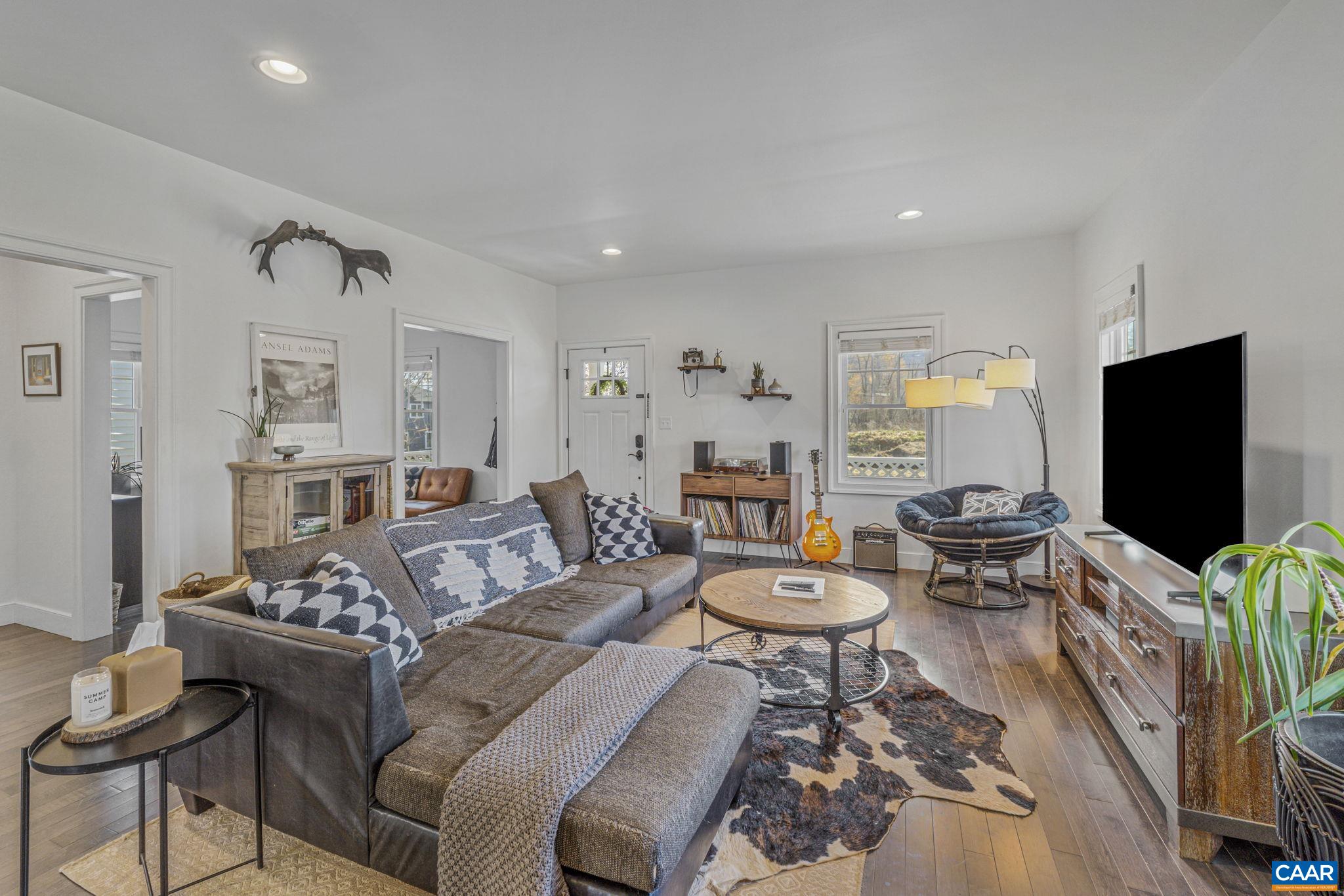 Built in 2016, this home offers an efficient, open floor plan that maximizes space and functionality. On the main level, the layout flows from the inviting front porch into a bright and airy living space. There are high ceilings and plenty of windows that create a welcoming atmosphere. Contemporary finishes and fixtures add style and sophistication. The kitchen features stainless steel appliances, granite countertops, white cabinets, a large island, and pendant lighting. An office is tucked away off the main living room. Upstairs, there are three bedrooms, including a primary suite with walk-in closet, two full bathrooms, and laundry. Step outside to enjoy the fenced backyard, perfect for pets, gatherings, or quiet relaxation. Most everything in this home looks brand new, reflecting meticulous care and modern craftsmanship. Conveniently located close to Belmont’s shopping, dining, and parks, this home offers a blend of style, comfort, and accessibility.