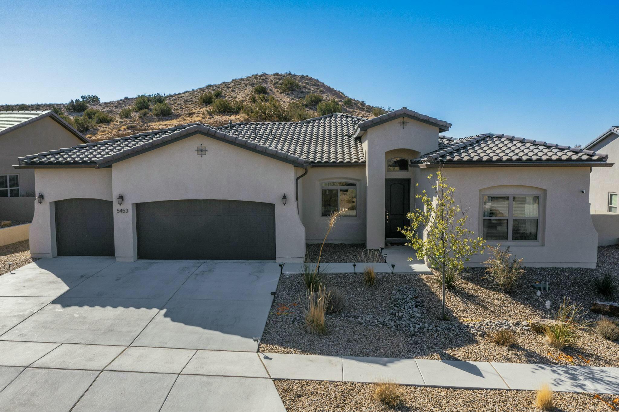 Welcome to this stunning 4-bedroom, 3-bath home in the highly sought-after gated community of Mariposa. Enjoy breathtaking mountain views and resort-style amenities including a clubhouse, pool, and fitness center. The spacious kitchen opens to the living room, creating the perfect space for entertaining. The split floor plan offers privacy, with a luxurious master suite featuring a spa-like bathroom retreat. Step outside to a beautifully landscaped backyard complete with a putting green--perfect for relaxation or fun. This home blends comfort, style, and functionality in one of the area's most beautiful communities.