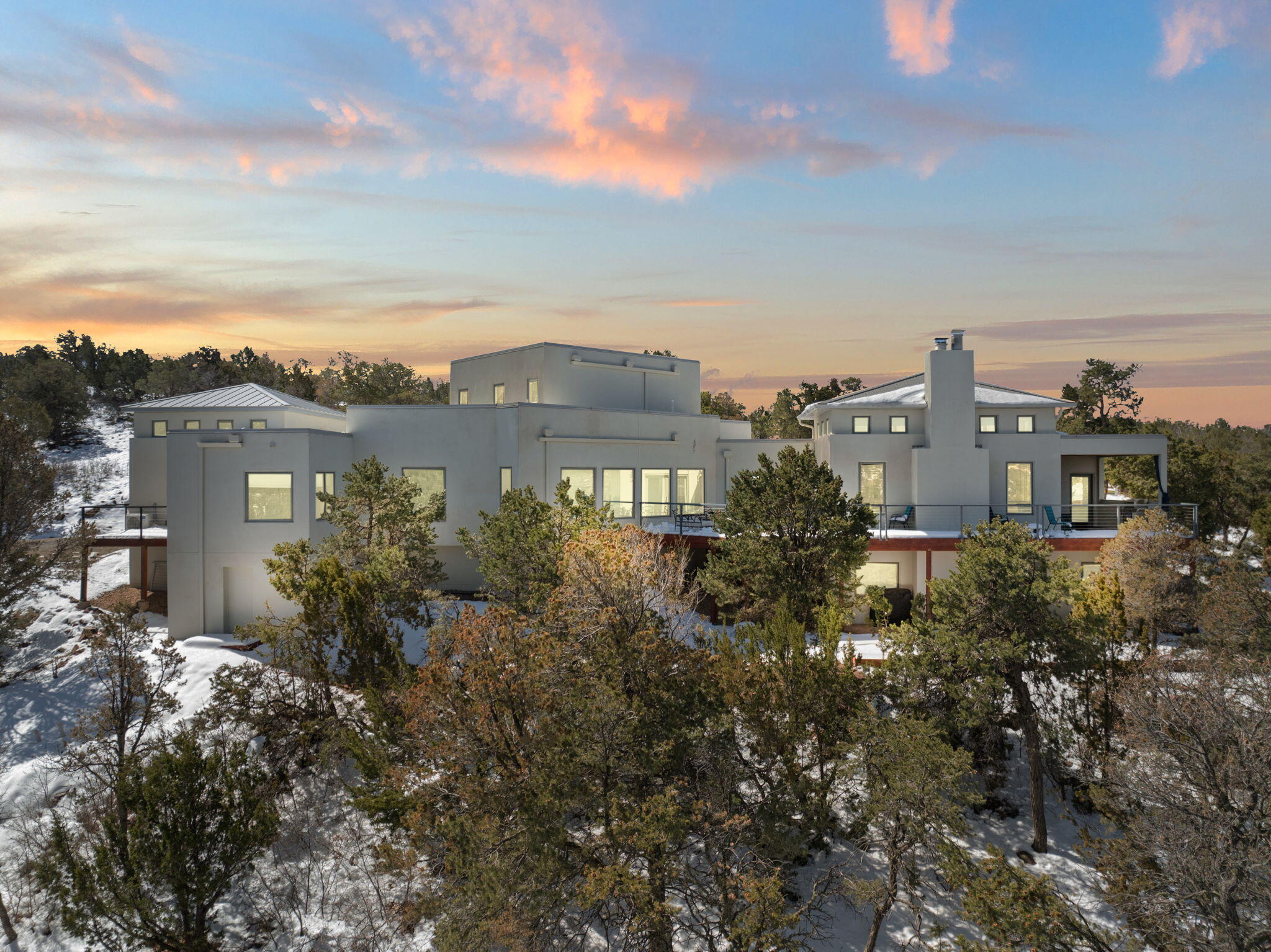 SELLERS ARE READY TO SELL! Modern luxury mountain living, Easy drive to Albuquerque and SF. Perfect for entertaining or as a quiet retreat. Private, gated neighborhood: 5-acre + lots, custom homes. Drenched in natural light. Sweeping views of the entire east slope of the Sandias. Expansive views from the many picture windows.  Energy efficient FIRE RESISTANT ICF construction. Private decks off of every bedroom. Mini-splits throughout. 6-burner gas range with pot filler. Wine fridge. Giant walk-in laundry room. Over-sized, finished 3-car garage. Lots of extra storage. Easily accessed crawl space. Solid hardwood/carpet/and ceramic tile flooring. Custom solid wood cabinetry throughout. 2 wood-burning fireplaces. Horses allowed. See supplement and docs for more. BRING US AN OFFER!