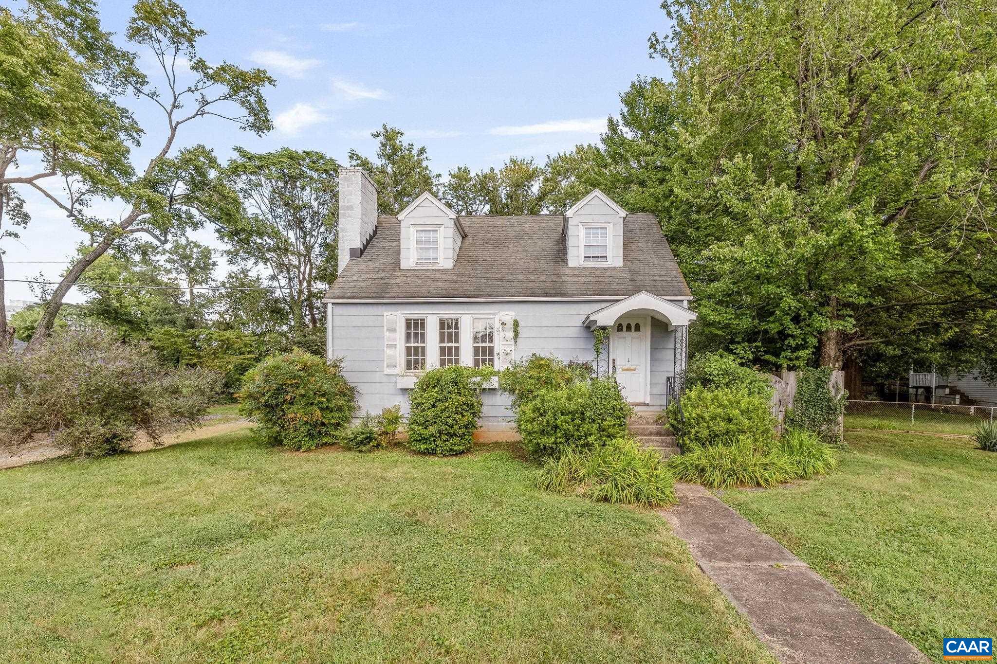 Nestled atop a sunny knoll in the highly sought-after Fifeville neighborhood, this delightful 3-bedroom, 2-bath Cape Cod blends timeless character with exciting potential. Just a short jaunt to the University of Virginia, the Downtown Mall, & an array of charming shops & restaurants, this gem offers the best of Charlottesville living. Surrounded by mature trees, the home features hardwood floors, a cozy fireplace in the living room, & a freshly painted interior that feels both bright & welcoming. The eat-in kitchen nook & sun-drenched enclosed rear porch provide perfect spots for morning coffee or quiet reading. Downstairs, you’ll find a spacious walkout basement with its own entrance. Whether you envision a guest suite, home office, or rental unit, there’s plenty of room to make it your own. Architectural plans for an elegant renovation are included, helping to bring your dream home—or investment property—to life. Bonus features include ample free off-street parking & generous basement storage. The property is zoned R-B & eligible for expansion. With an adjacent .14-acre lot also available, each offer the option to build up to 6–12 multi-family units or to create a spacious compound with room to grow, play, & entertain.