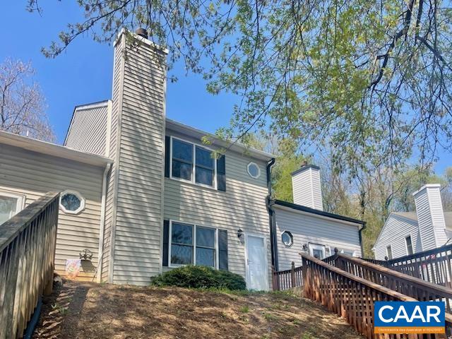 A wonderful opportunity awaits in Belmont FEATURING OFF STREET PARKING! Enjoy stunning VIEWS of Carter Mountain from the front, and take a stroll to Rives Park where you can relax in the pavilions, enjoy the playground, or have fun with your Fido. This conveniently situated property offers easy access to the Downtown Mall, popular dining spots, and multiple parks, with UVA and PVCC just a short drive away. The home has been FRESHLY PAINTED and features NEW FLOORING throughout. The main level showcases a cozy living room with a charming fireplace, a bright white eat-in kitchen equipped with soft-close cabinetry and new countertops, and access to the backyard patio, perfect for grilling. Additionally, there is a coat closet, half bath and laundry area on this floor. Upstairs, you will find three spacious bedrooms, a full bath, and a linen closet for added convenience. This is a must-see in Belmont to maximize your value with the convenience of city living and no HOA dues. MOVE-IN READY!