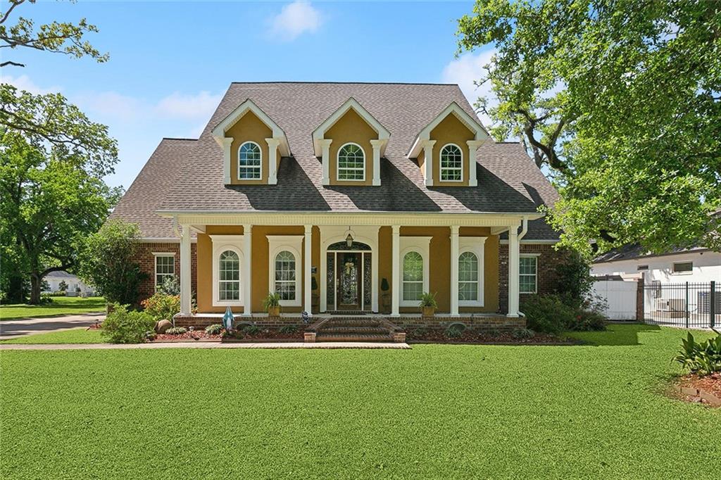 Tucked away in the oaks off of River Road, this exquisite Southern estate blends classic charm with modern luxury with the main house and a separate guesthouse. The main house includes 5 bedrooms, 3 full baths and 1 half bath, and from the moment you step inside, you’ll be captivated by the spacious layout, custom finishes, and thoughtful design throughout.

The heart of the home is the expansive kitchen and dining area—an entertainer's dream—featuring a gas range with a custom vent hood, double wall ovens, and built in double refrigerator. Welcome your guests to the spacious formal dining area, while the inviting living room offers a cozy gas fireplace, built-in bookshelves, and dual French doors that open to a tranquil back patio. 

The main-level primary suite is a true retreat, complete with private patio access, an oversized walk-in closet (18'7" x 5') with storage shelves, and a spa-like en-suite bathroom with an oversized soaking tub, double vanity, separate shower, enclosed water closet, and an additional massive closet--if you didn't feel like sharing the closet in the bedroom.

Upstairs, you’ll find four generously sized bedrooms, including a second en-suite bedroom with a full bath—great for guests or multigenerational living. There's also an open-ended room that could be used as an office, or an upstairs lounge or game-room.

The detached guesthouse, connected to the two-door garage with front and rear access, features two half bathrooms and a spacious upstairs game room or billiard room with a wet bar, refrigerator, and built-in shelving—the ultimate space for leisure and hospitality.

Step outside to your private oasis: a solar-powered saltwater pool with jacuzzi, a covered outdoor kitchen with granite countertops, a sink, and TV hookup. Additional upgrades include a whole-house generator, recessed lighting, and a tankless water heater.

This extraordinary property offers luxury, comfort, and convenience—all wrapped in Southern elegance--in St. Charles Parish's top-rated school system and an "X" non-flood zone.
