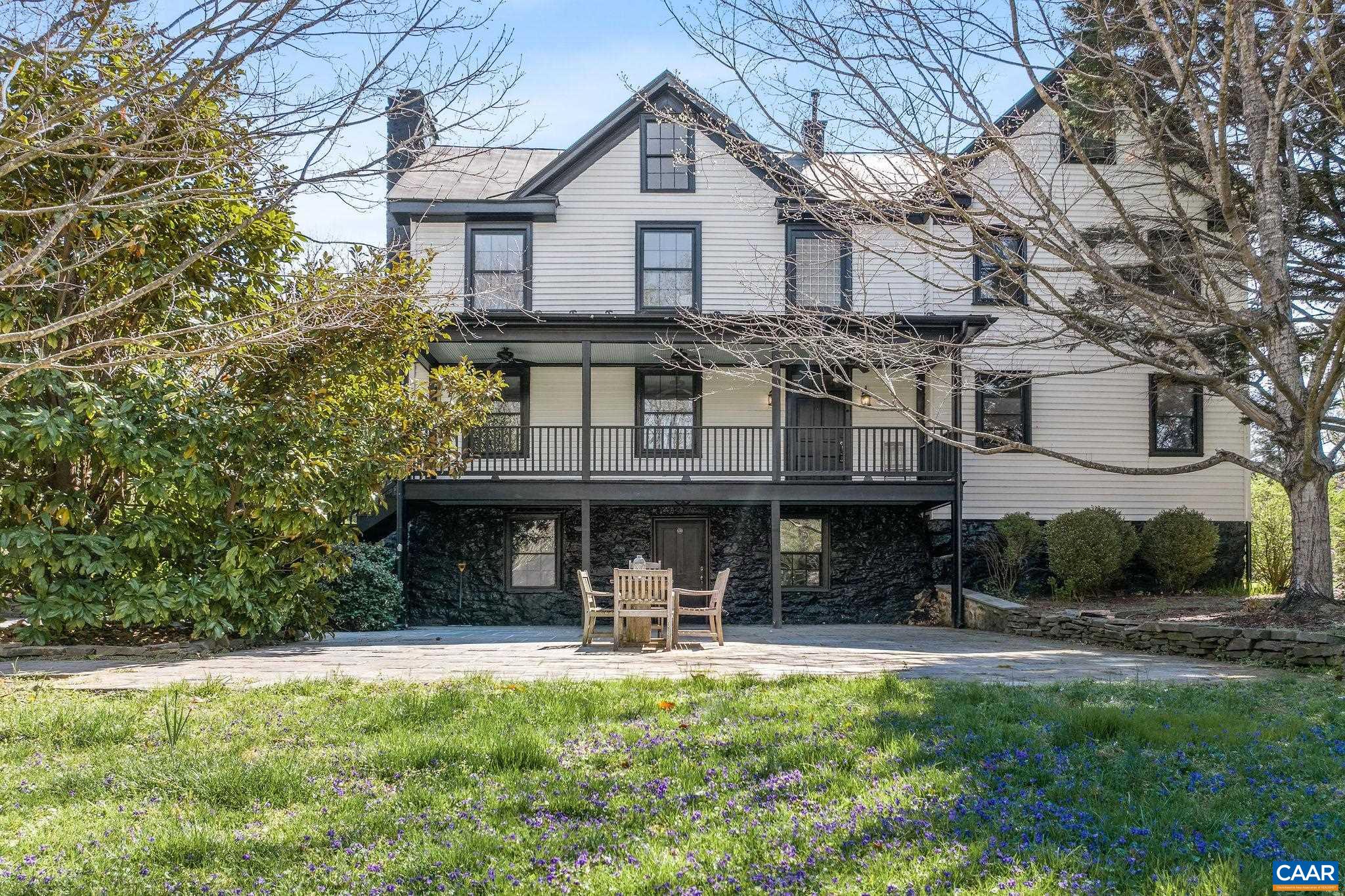 This prominent Historic property built in 1800 was at one time a civil war general store is set on 6.86 private and tranquil acres with a small stream that meanders alongside the property. This classic home has been comprehensively renovated making it a very distinguished residence. The interior boasts antique beams, vaulted ceilings, 5 stone fireplaces, beautiful hardwood floors & moldings. The exterior and outdoor spaces include large porches, a bluestone courtyard. In addition to the main house is also a beautiful, large and very charming “log cabin style” guest house that can also be used for various purposes (built as a music studio). Located 10 miles south of Charlottesville and within minutes to vineries and restaurants. MLS# 663188