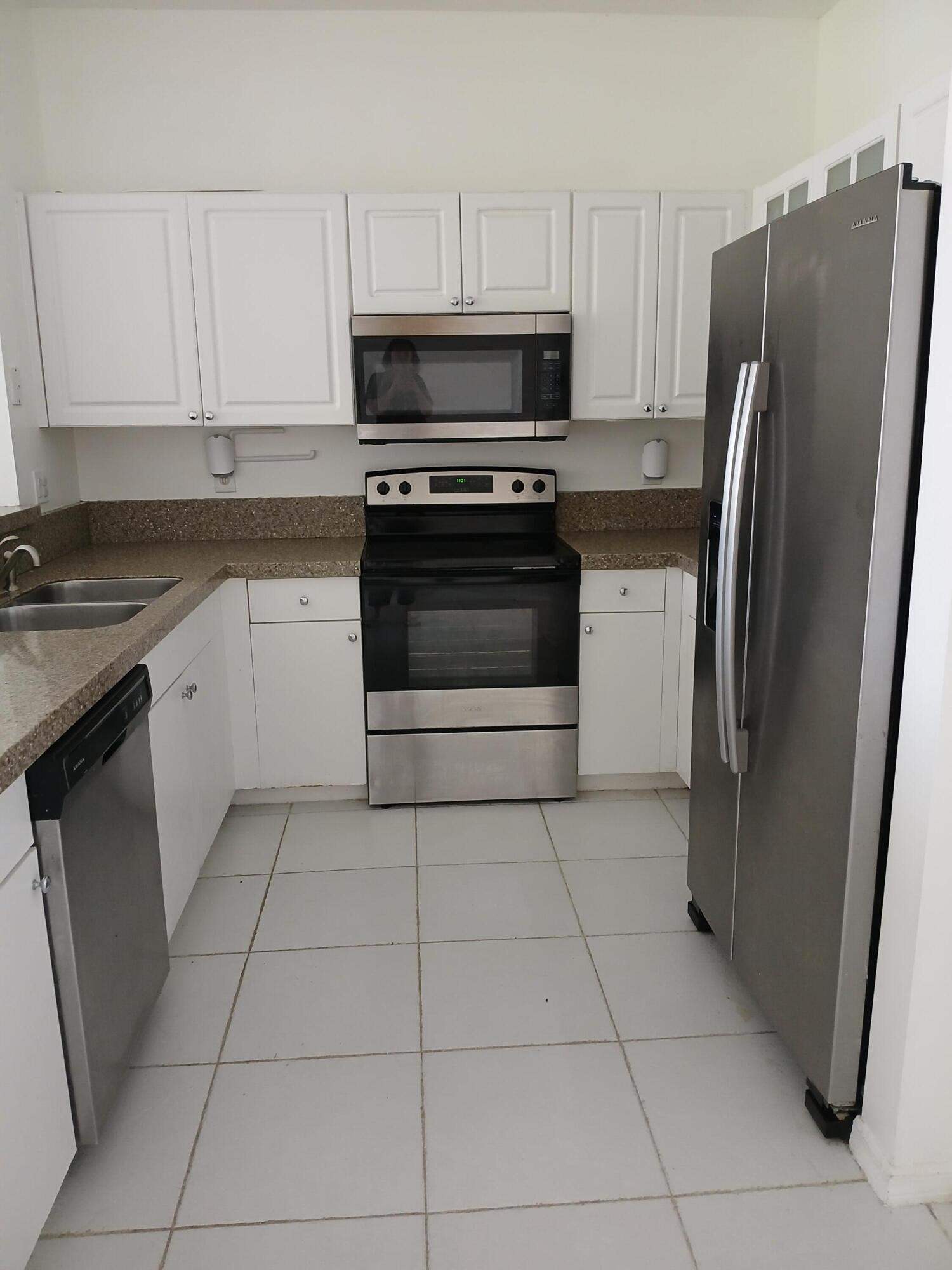 Lake Front Townhome in gated community with tile on 1st floor and wood on 2nd floor, stainless steel appliances, washer, dryer, central air, 1 car garage, community pool and children play area. Located behind Costco and water park. Includes one year home warranty includes all appliances, a/c and plumbing.