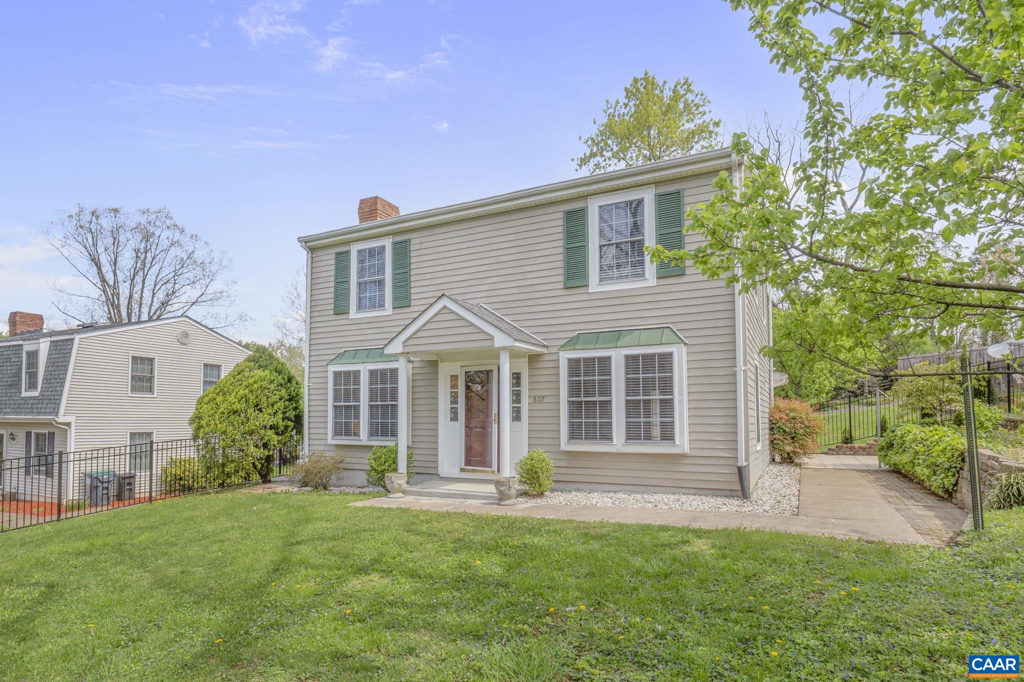 Five Minutes to Downtown + Fenced yard.  Just five minutes from the Downtown Mall, this well-maintained 3-bedroom, 2.5 bath home offers a rare combination of location, space, and outdoor living.  The large kitchen flows into a light filled dining room and there is a separate living room with a fireplace - ideal for both quiet nights in and easy entertaining.  Wood floors, abundant natural light, and a smart layout make the enterior feel warm and open.  Outside, enjoy a fenced yard perfect for pets, play, or gardening, plus a separate storage room for all your extras.  A solid find in one of Charlottesville's most convenient spots.