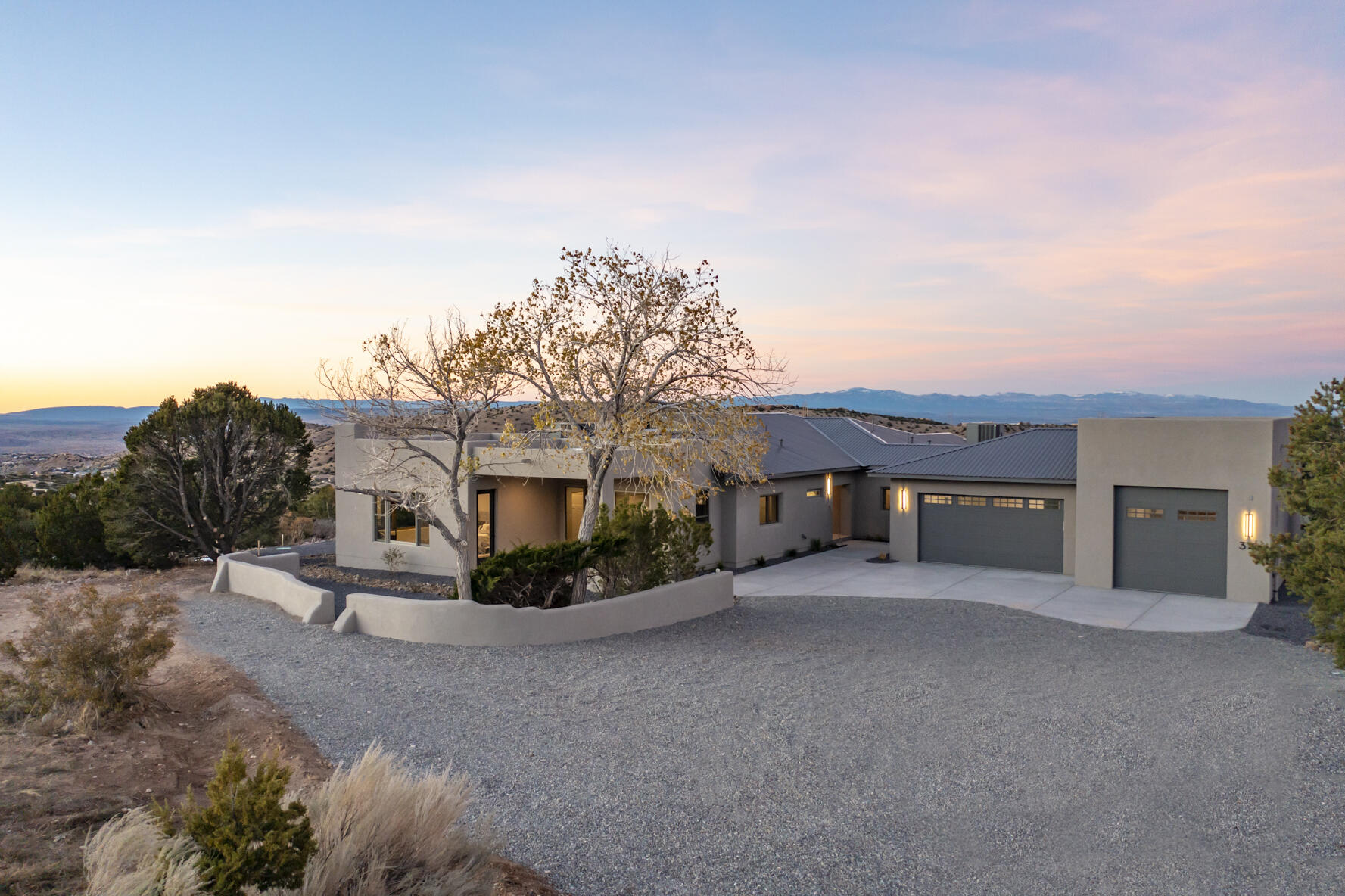 Top of the mountain! Custom home built by Enchanted Spaces, Placitas' premier custom home builder & featured in the 2025 Parade of Homes. Enchanted Spaces creates an amazing floor plan with a Scottsdale meets New Mexico design style. The builder's vision starts with capturing the best that Placitas has to offer-the views! This 1.8+ acre lot is simply the best view lot in Placitas & captures Sandia Mountains, Jemez mesas, Santa Fe, Cabazon, Rio Grande Valley & city light views. Home features 3 bedrooms with En Suite baths, office, 2 living areas, chef's kitchen, finished walkout basement bonus room & 3 car garage w/RV bay. Deluxe finishes include wood floors, cathedral ceilings, wood windows & adobe/frame walls. Multiple covered patios to enjoy mountain views & landscapes of New Mexico.