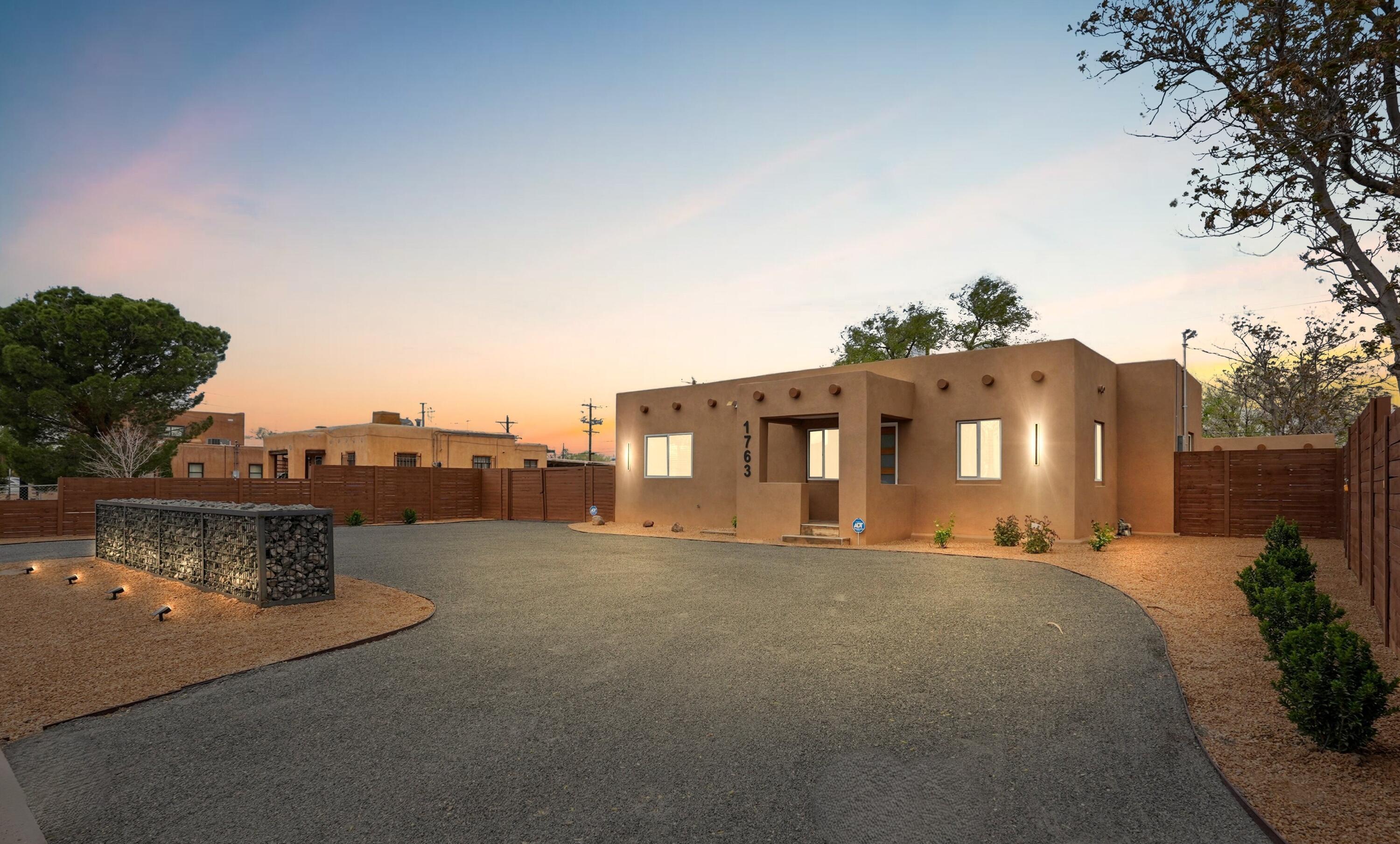 Beautifully renovated home on huge lot in heart of Albuquerque's historic North Valley. The perfect blend of old-world charm & modern sophistication in a stunning 1936 original adobe home. Oversized kitchen features huge 10ft x 6ft center island, modern appliances, new custom-built hardwood cabinetry w/ample storage, undercabinet task lighting, & beautiful quartz counters. New roof, new thermal-pane windows, new stucco, new refrigerated a/c. Two new baths feature new plumbing, fixtures, tile and lighting. X-large utility rm w/more storage. Includes private detached studio/flex space, plus rear access with plenty of room for RV storage or a large shop/casita etc.