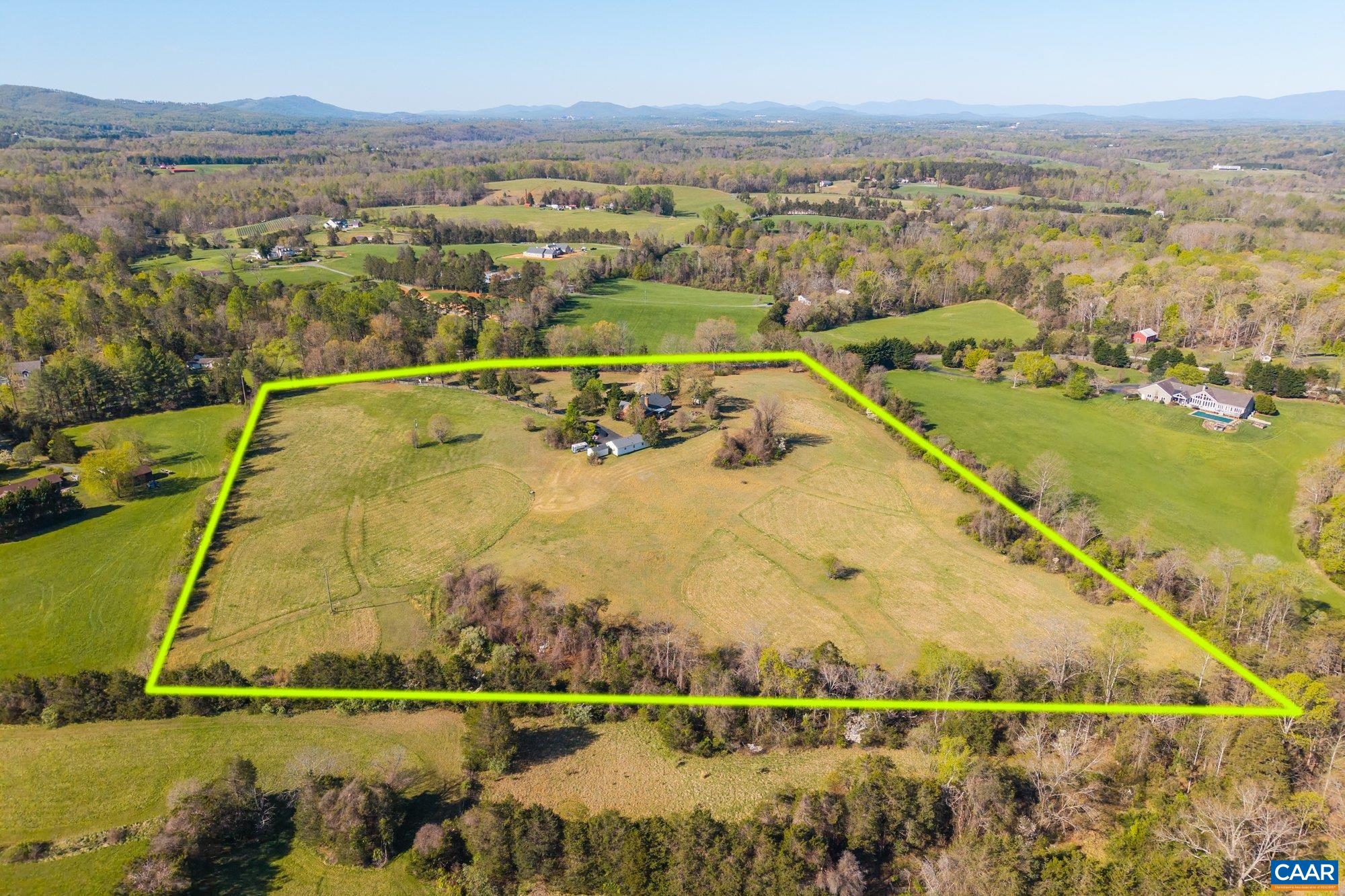 Welcome to Fallowfield Farm!  15 STUNNING ACRES located in one of the most desirable locations in Charlottesville.  This 4 bedroom, nearly 3000 square foot brick home has amazing potential. The home also features a PRIVATE GATE entrance, 2 car detached garage and a work shop.  The 15 acres offers a beautiful private setting with mountain views. Located in the desirable Stony Point area within close distance to shopping, restaurants, wineries, breweries, hospitals, great schools, and the airport.  The home needs some updating but the location and 15 acres make this property an OUTSTANDING VALUE!