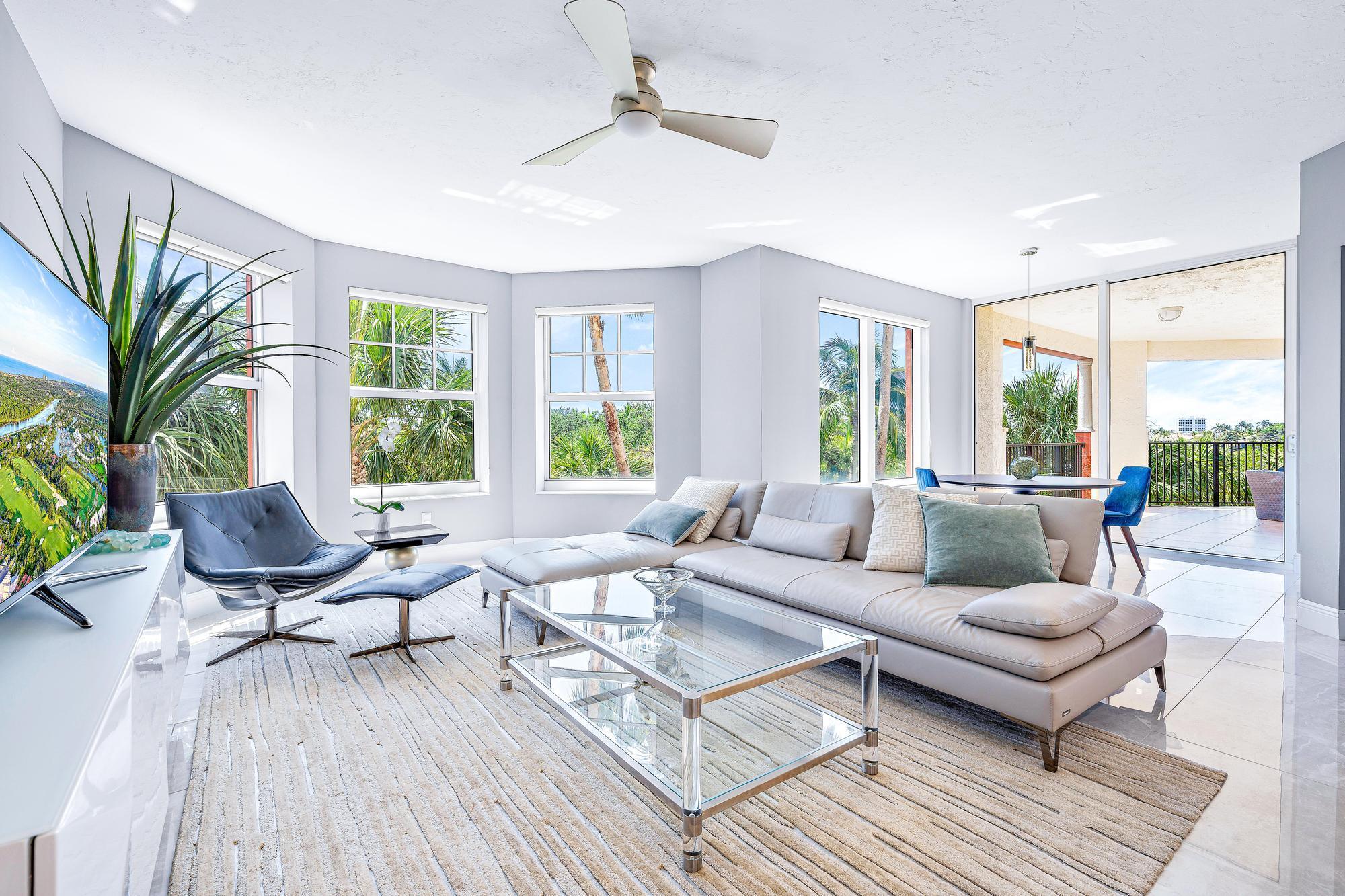 Completely renovated in 2021, this corner unit at Jupiter Yacht Club offers a refined, comfortable lifestyle on the Intracoastal. Updates include all-new bathrooms, a modern kitchen, oversized marble tile flooring, and upgraded plumbing in both the kitchen and laundry room. With over 3,000 square feet of living space, the layout feels more like a single-family home. Natural light fills the spacious family room and expansive salon, thanks to an abundance of windows and floor-to-ceiling sliding doors. Step outside to a 500-square-foot wraparound patio--perfect for relaxing or entertaining--while enjoying beautiful views of the Intracoastal. Residents enjoy access to a range of amenities, including a heated saltwater pool, poolside summer kitchen and BBQ area, a gated dog park, a manned front gate, and a dedicated under-building parking space. Boat slips in the protected Jupiter Yacht Club Marina are available for lease or purchase. This is peaceful, easy living in the heart of Jupiter&#x14;just minutes from the beach and within walking distance to Harbourside, popular local restaurants like the Dive Bar and Caf+¬ des Artistes, boutique shopping, entertainment, and top-rated golf courses.