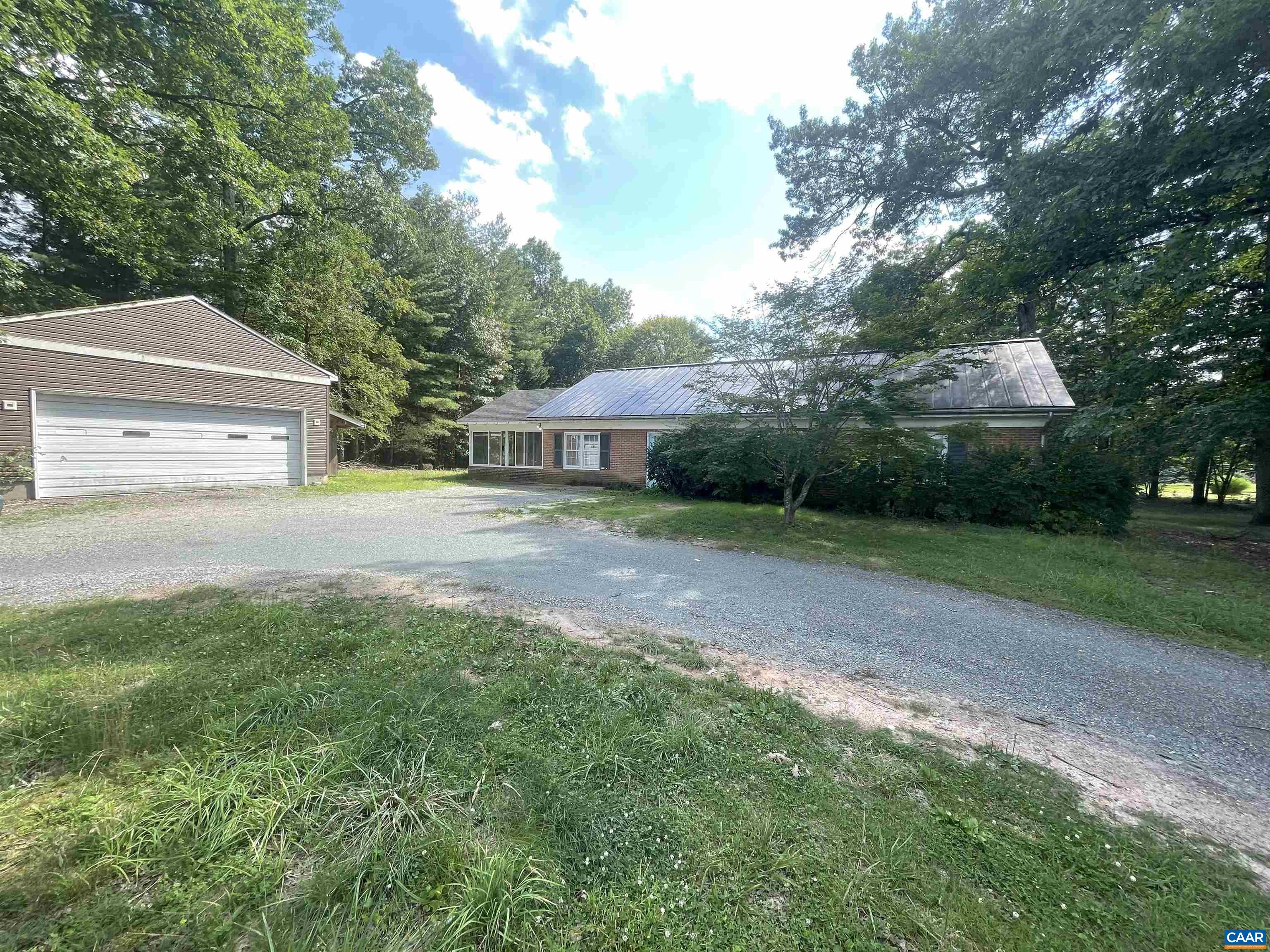 Location, Location, Location! Imagine living in a nicely updated one level 3 bedroom house only 1.5 miles from Preddy Creek Park!  Featuring a new Metal Roof, Enormous oversized garage workshop, almost 2 acres of land & extra storage building! The Garage with large roll door and power is 660sq ft. There is an additional block 400sq ft building and the house has a great attached screened porch!  This updated Ranch 3 bedroom 1.5 bathroom house has ceramic flooring in dining room, laundry and kitchen. Wood lvp in living room hallway and bedrooms. The updated bathroom is unique and the stainless appliances shine against the painted wood cabinets and butcher block counters. Enjoy the convenience to town; and the privacy of the country all in one place!! Come see this home today!