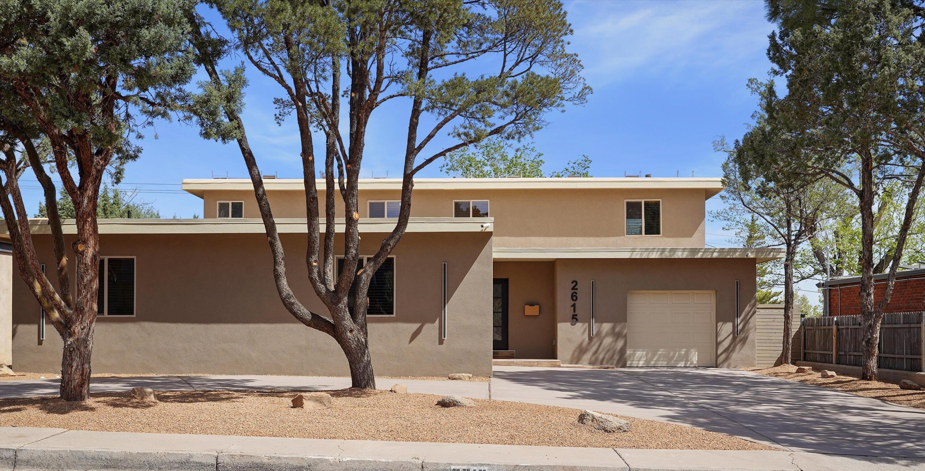 Beautiful, exquisitely remodeled luxury home in Vista Larga historic district. This fully updated midcentury-modern home features a large state-of-the-art kitchen with new custom-built hardwood cabinets, center island with waterfall quartz counters, and a private coffee bar. Two primary suites are privately situated at opposite ends of the house. Three fully redesigned luxury bathrooms have all new plumbing, fixtures & cabinetry. Three separate family/entertainment spaces all with patio/balcony access, and a large formal dining area. Plus find an additional flex space through the garage, perfect for an office or studio. New stucco, new TPO roof, new tankless, New HVAC and fully owned Solar! Upstairs family room opens to balcony w/ mountain view.