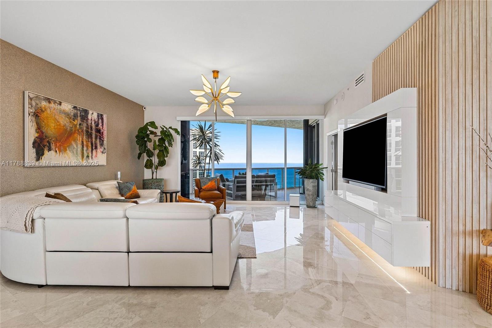 Newly Remodeled Sub-Penthouse modern luxury unit with 10-foot ceilings, direct ocean-front view with open concept kitchen and two generous balconies that give both city and direct ocean views from sunrise to sunset! 3rd bedroom is currently used to expand kitchen great room area and can be easily converted to a bedroom & bath. A/C 2 yrs old, security cameras interior and outside, alarm system, new electrical, custom primary closet, LED lighting, under kitchen cabinets and bar and TV surround sound! 2 Full baths and 1 1/2 bath. Furniture is included.  10+ acres of Oceanfront/Beachfront property with tennis, fitness, fenced complex, sauna & steam rooms.  Attended beach with spas & cafe.  Pet friendly.  Garage parking or Valet, space has electrical.  A Must See!!!