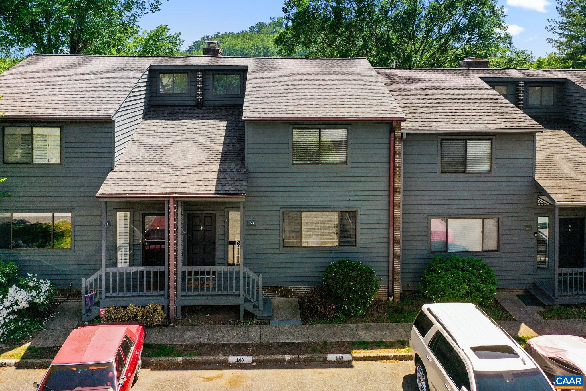 Huntington Village. 2 bedrooms, 2 1/2 bath unit featuring a freshly painted interior,  newly renovated kitchen, with increased ceiling height, new cabinetry, new granite surfaces and stainless appliances. New LVP flooring throughout the main and upper levels. Primary suite offers private deck. Home has 2 brick fireplaces. Large rear patio with private wooded view. Close to UVA, JAG, Business School, shopping and much more.   Unfinished basement has the ability to add a bedroom, and full bathroom, with direct access to exterior