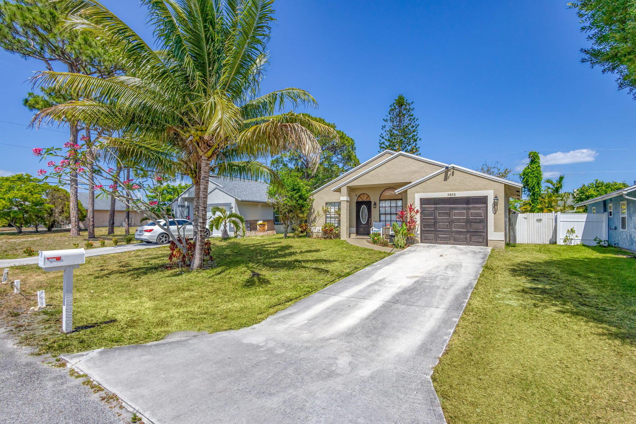 Photo 1 of home located at 5855 SE Mitzi Lane, Stuart FL