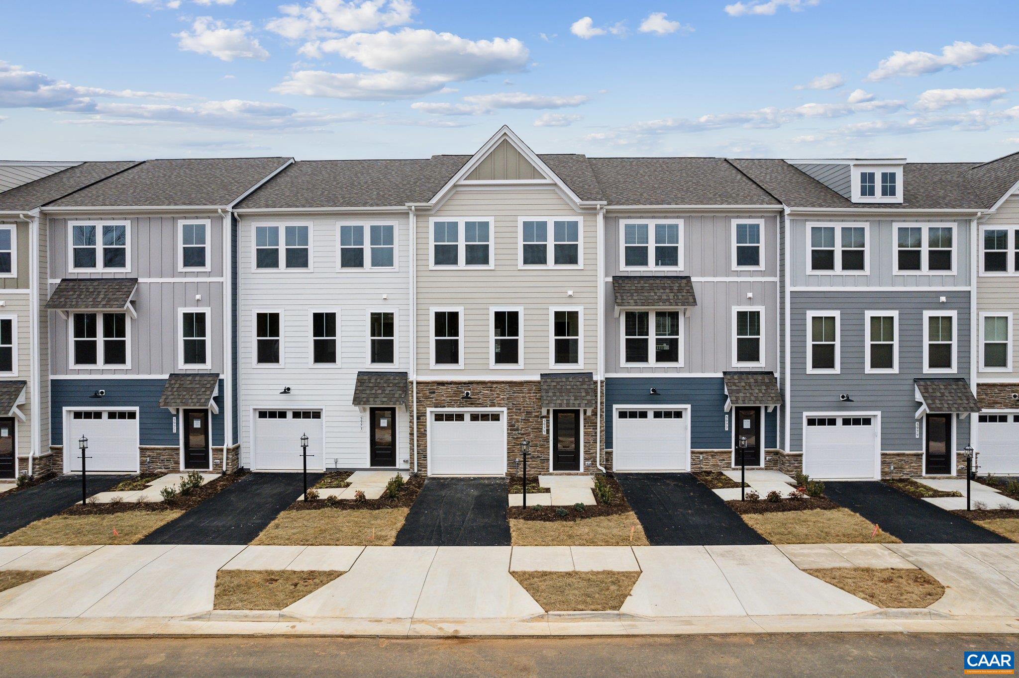 Explore the Lucas townhome at Pleasant Green—no rear neighbors and an oversized 1-car garage—with an estimated Aug/Sept 2025 completion. Just steps from Downtown Crozet, this 3-bedroom, 2.5-bath home offers three finished levels of smart design and modern comfort. The entry-level flex space is perfect as a home office, gym, or extra living area, with interior garage access. On the main level, enjoy open concept living with durable LVP flooring, a spacious living room, and a kitchen with GE® stainless appliances, quartz countertops, large island, and a dining area that opens to a private rear deck. Upstairs, the primary suite includes a walk-in closet and private bath with dual vanities. Two additional bedrooms, a full bath, and bedroom-level laundry provide convenience for daily living. Exterior features include low-maintenance Hardie® siding, HOA-covered lawn care, and new home warranty coverage. Enjoy fire pits, a renovated clubhouse, and a playground—all walkable to shops, dining, and scenic Crozet trails. *Photos are of similar homes; some images may be virtually staged. Visit our model home today!