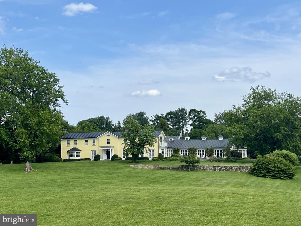 Gracious Country Living Meets Modern Luxury at Aquinnah. Welcome to this extraordinary 1860 estate nestled in the heart of Orange County Hunt territory minutes from both Middleburg and route 66 access. Thoughtfully restored and seamlessly expanded, this 7-bedroom, 8 full and 2 half-bathroom residence is a rare blend of historic charm and sophisticated amenities. Spectacular views all the way from Ashby Gap to Cobbler Mountain! From the heated indoor lap pool and hot tub to the tennis courts with a fully equipped tennis house, this home is designed for both relaxation and recreation. The chef's kitchen features double islands, a butler's pantry, heated floors, and a built-in wine fridge””ideal for both intimate gatherings and grand entertaining. A Sonos sound system graces the main level, while five fireplaces offer cozy elegance throughout. An attached private suite with separate entrance, a charming guest space/home offices with one full bathroom, kitchen, and multiple upstairs rooms (also with high speed internet). For the equestrian lovers, a professional barn with a heated and air-conditioned 2-bedroom apartment create generous guest accommodations. The barn is also equipped with run-ins equipped with fans, automatic waterers