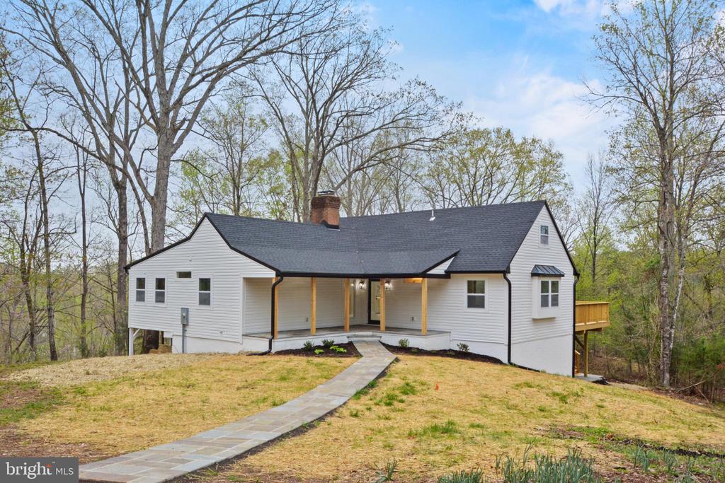 Welcome to this beautifully renovated 5 Bed, 5 Bath home situated on 14.75 acres with a gorgeous stone bridge located in Western Albemarle. This property is the perfect blend of modern and countryside living. All new roof, new siding, new windows, new HVAC, new deck, new patio, new driveway, new white oak hardwood floors throughout main level, new tile in basement, new kitchen with quartz countertops and stainless steel appliances, and fully renovated 5 bathrooms.