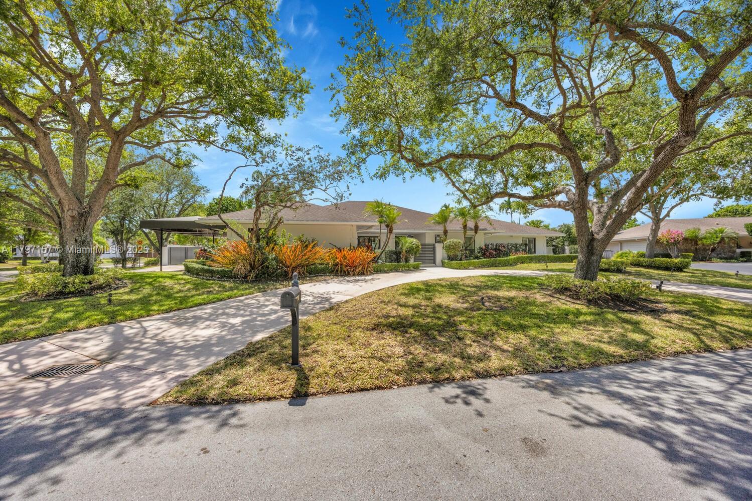 Picture-perfect Palmetto Bay home on a quiet cul-de-sac in “NO FLOOD ZONE!” (hard to find!) Over 4,550 square feet under roof, this beauty features a 2018 roof, impact windows/doors, full-house generator, split-bedroom layout, and indoor laundry room. The white kitchen with vaulted tongue & groove ceiling overlooks a saltwater pool, screened patio, summer kitchen, and covered seating—great for entertaining. Enjoy marble-like tile, Plantation shutters, spacious primary suite with luxe bath and walk-in closet, and custom millwork throughout. New Rheem AC, KitchenAid fridge (2023), new water heater, new awning carport, two concrete driveways with lots of parking, lush landscaping with mature oaks, privacy wall, and tons of natural light!