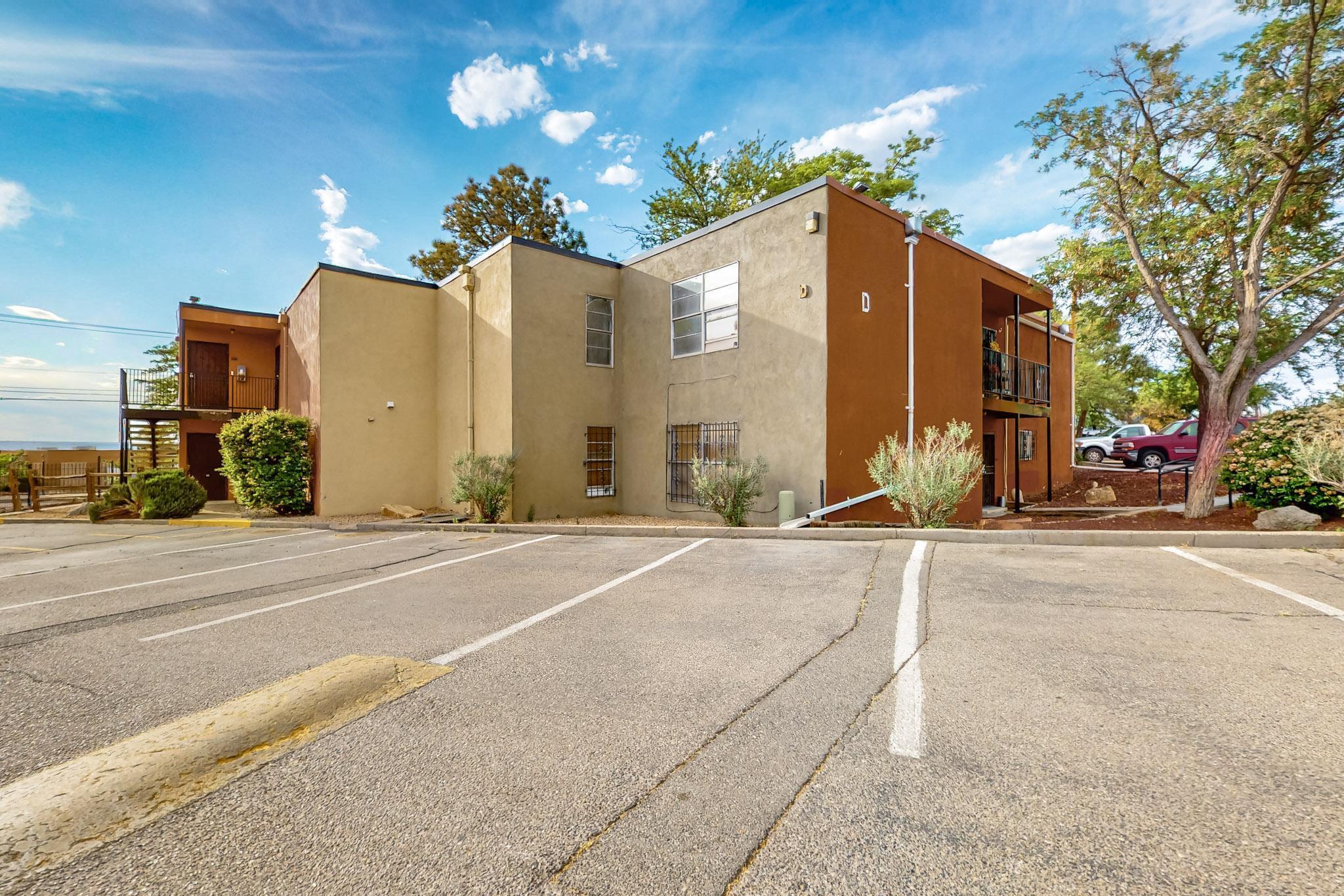Prime location! Updated 1 bedroom, 1 bath condo perfectly situated directly across from Puerto del Sol golf course and minutes from the military base, UNM, and freeway. Ground floor next to parking. Seller offering $15k concession toward new HVAC system.