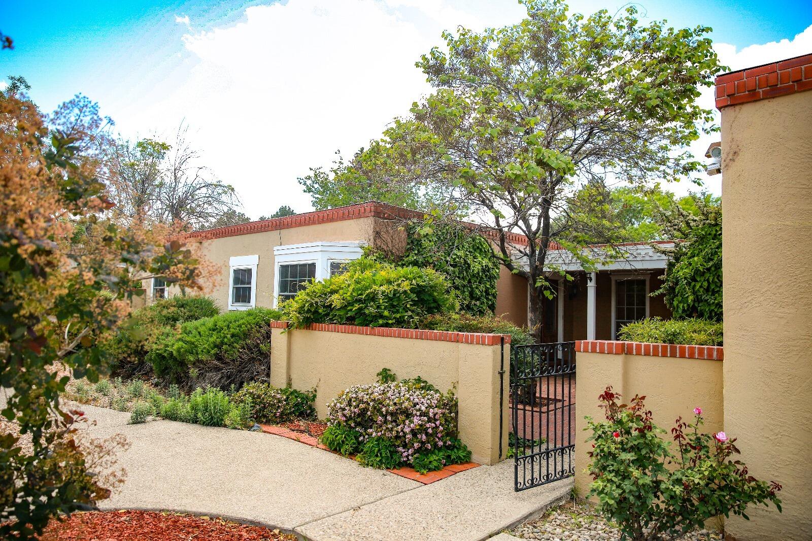 Welcome to this beautiful territorial-style home in the highly desirable neighborhood. Charming 4bed, 2bath, 2 living & dining areas with rich wood flooring throughout most of the home, Freshly painted, maintained roof, refrigerated air in 2024.  Classic Mossman architecture--known for quality and timeless design. Mountain views from the front courtyard and kitchen, adding a scenic backdrop to your everyday living.