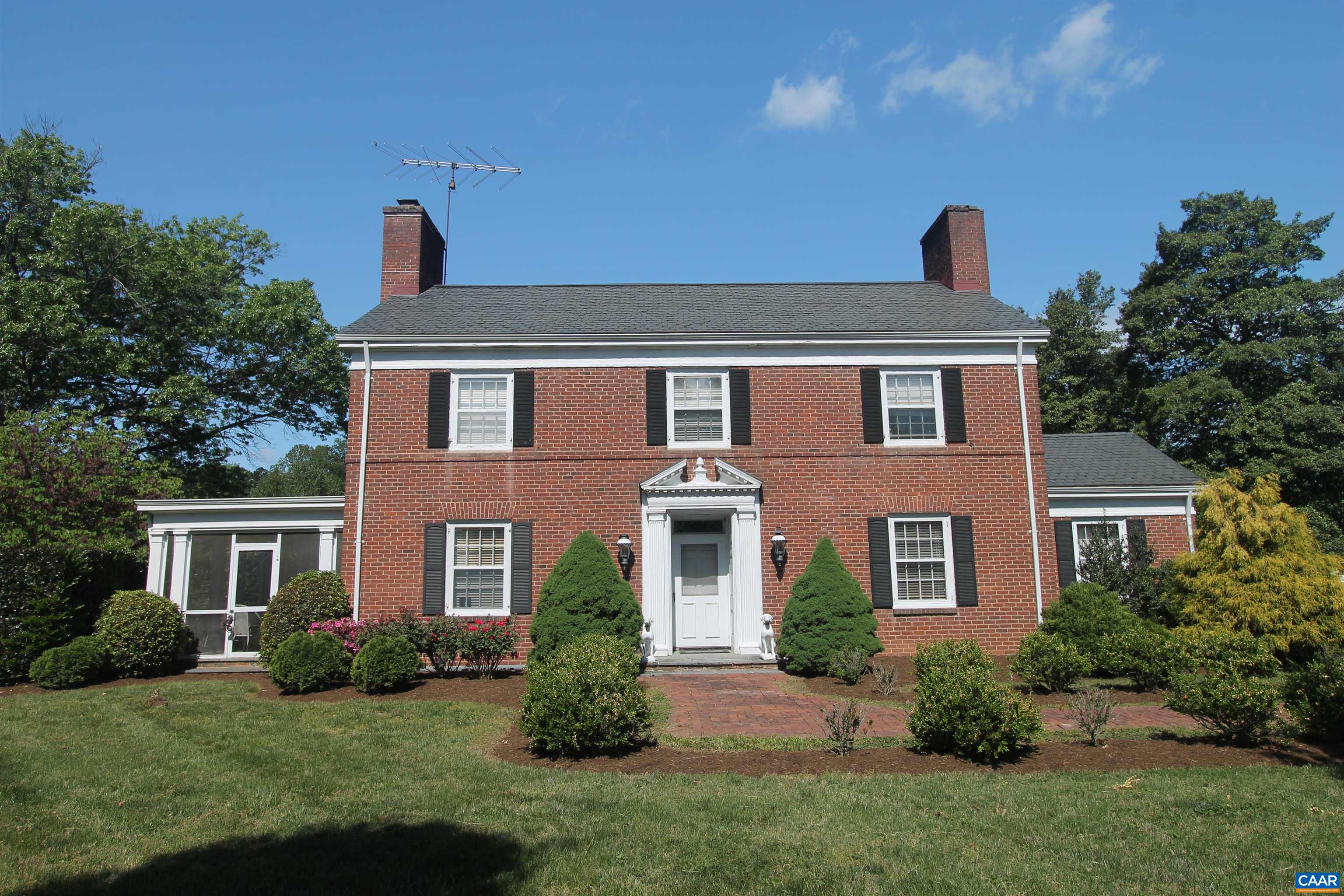 Out of Bounds is a stately brick residence that offers an exceptional blend of location, privacy, and timeless character. Nestled on beautifully landscaped grounds, this classic two-story Virginia home was built in 1940 and features nearly 3,000 finished square feet of refined living space.  The gracious interior showcases high ceilings, generously proportioned rooms, 4 Fireplaces, and extensive custom wood trim throughout. With stunning views of the manicured grounds, the home provides both elegance and comfort—ideal for entertaining or everyday living.  Additional highlights include a charming screened-in porch, a detached garage with carport, and mature gardens accented by brick and stone walkways. The property offers remarkable privacy while enjoying the convenience of an in-town location—and may also include possible division rights.   This is a rare and wonderful offering—an ideal opportunity to own a distinctive home in one of the area’s most desirable locations.