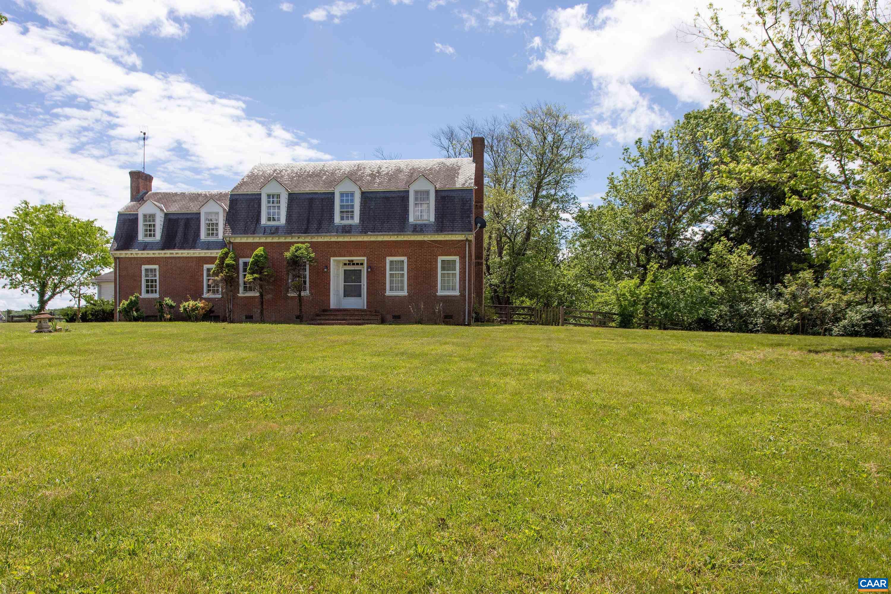 This rambling farmhouse is perched atop 37.63 acres in Albemarle County close to Charlottesville's amenities. The perfect location provides the opportunity to create the working farm of your dreams or build a grand horse property.   This 3-bedroom 4-bath home features rustic charm with two fireplaces, spacious floorplan, and ample light.  Outside the mature shade trees, pastures, and pond offer a peaceful private retreat. Multiple outbuildings including the six-stall barn, five-stall run in, and three-stall show barn, run ins, equipment shed, and hay storage (water spigot at each), makes this property ideal for horses, llamas or other animals.  The show barn has its own well and septic as well as an RV hookup and outdoor shower.  The opportunity to build the farm of your dreams in this ideal location won't last long. Schedule a showing today!