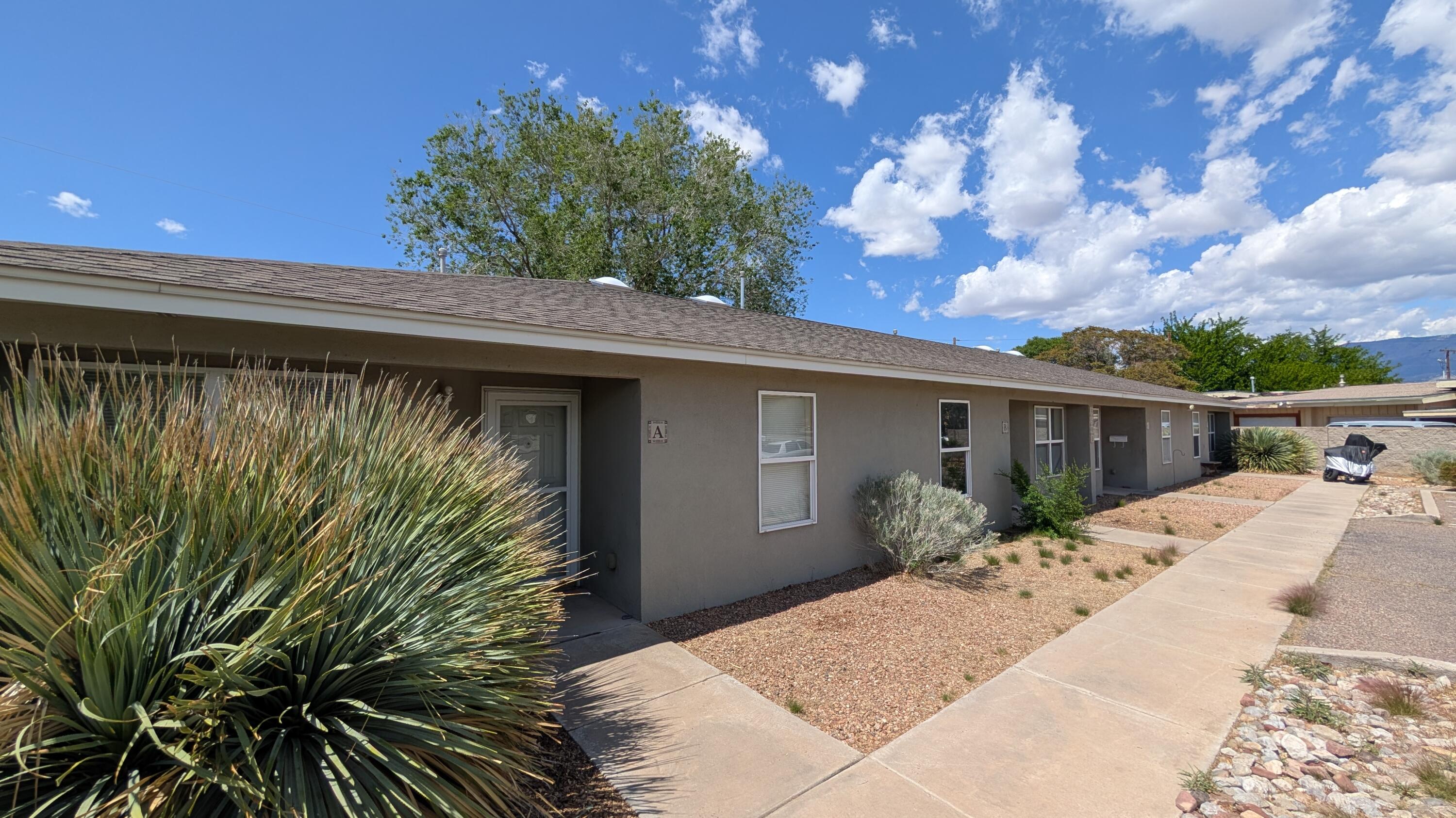 Excellent opportunity for investors or ''house hacking''- live in one unit, rent the others to help cover your mortgage and enjoy owner-occupied loan perks. This single-story 4-plex offers modern, low-maintenance construction in a high-demand rental area. Each 2-bed, 1-bath unit features tile floors in main areas, carpeted bedrooms, full appliance package (dishwasher, fridge, electric range), and washer/dryer hookups. Tenants enjoy refrigerated air, private walled yards with patios, and exterior storage. All units are individually metered and professionally maintained. Fully leased and located in one of Albuquerque's most stable rental corridors--close to shopping, transit, parks, and major employers. A solid, turn-key income property.