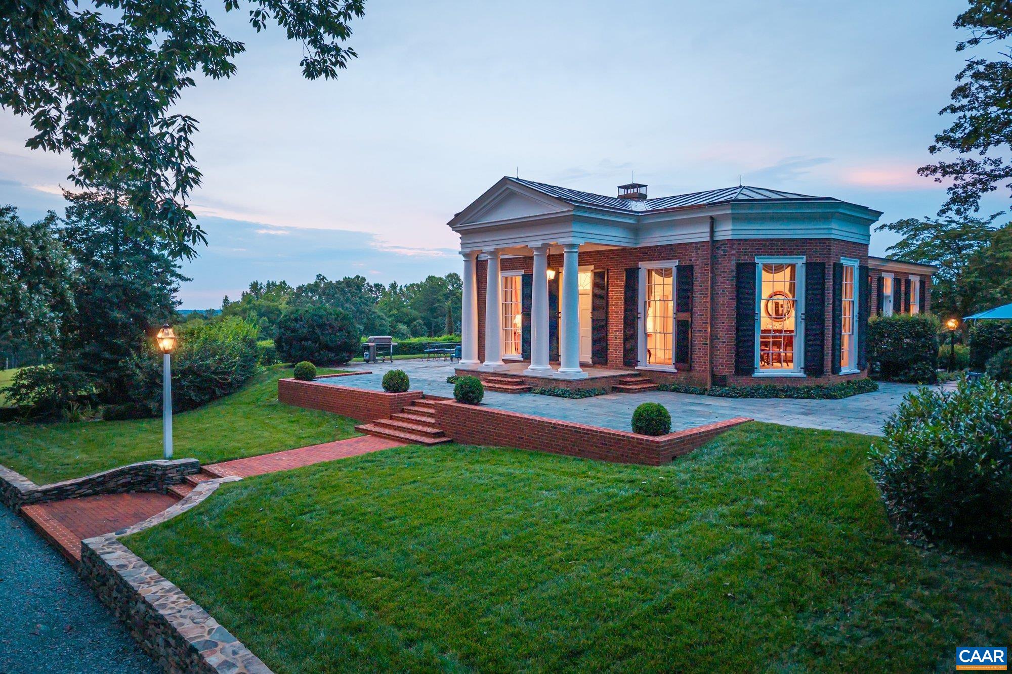 Situated just outside Charlottesville, Shack Mountain is a historic masterpiece designed by Fiske Kimball, founder of UVA’s School of Architecture. Built in 1935–36, the home pays tribute to Thomas Jefferson’s architectural legacy, modeled after Jefferson’s design for Farmington. A stunning example of Colonial Revival style, the residence features a Tuscan portico, triple-hung windows, Chinese Chippendale balustrades, and interiors inspired by Pavilion IX at UVA. Listed as a National Historic Landmark, Shack Mountain blends historical integrity with modern livability. Set on 102 acres, the property offers exceptional privacy, with mature trees, open meadows, extensive gardens, and expansive views. A private trail system loops through the landscape and leads to the Rivanna River, ideal for walking or peaceful enjoyment of the natural surroundings. Adjacent to the protected Ivy Creek Natural Area, the land offers added seclusion and lasting conservation. Just minutes from Charlottesville, this is a rare opportunity to own a piece of Virginia’s architectural and cultural history.
