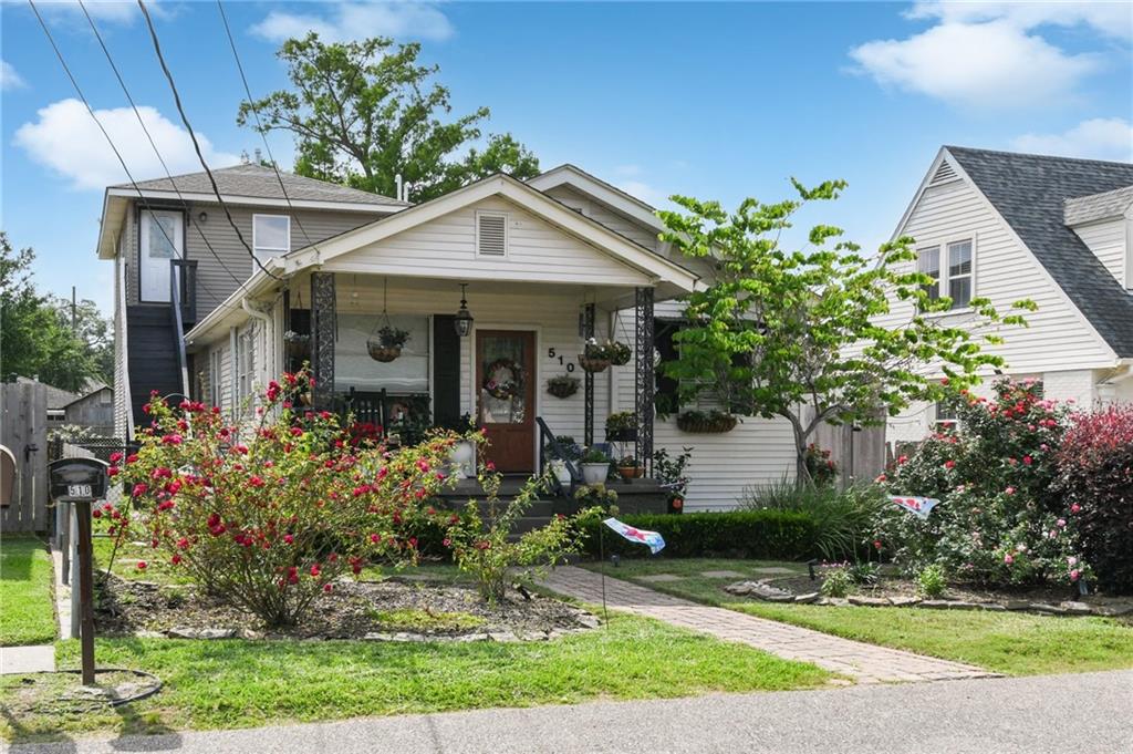 Adjusted price from Motivated Seller.  Charming updated cottage conveniently located on an oversized lot in Old Metairie. Well manicured garden with inviting covered front porch. Open Living and Dining floorpan including updated kitchen featuring custom cabinets, granite countertops, stainless steel appliances, walk-in pantry and mudroom with additional cabinets. Office/bedroom, second bedroom and full bath also in original cottage. First addition leads to 9ft ceilings and custom double crown molding in spacious den with wood/gas fireplace and built in entertainment center, large primary bedroom with walk-in closet plus on-suite bathroom featuring jacuzzi tub, and fourth bedroom has unique spiral staircase leading to sitting room in upstairs apartment. This two to three bedroom apartment has the potential for a Nanny suite, rental income, or your personal touch. Apartment has kitchen, bathroom, and sitting room. Additional exterior access to upstairs apartment. Upstairs sitting room and covered patio overlook large backyard with detached storage building. Driveway accommodates multiple vehicles as well as a secured side entrance.