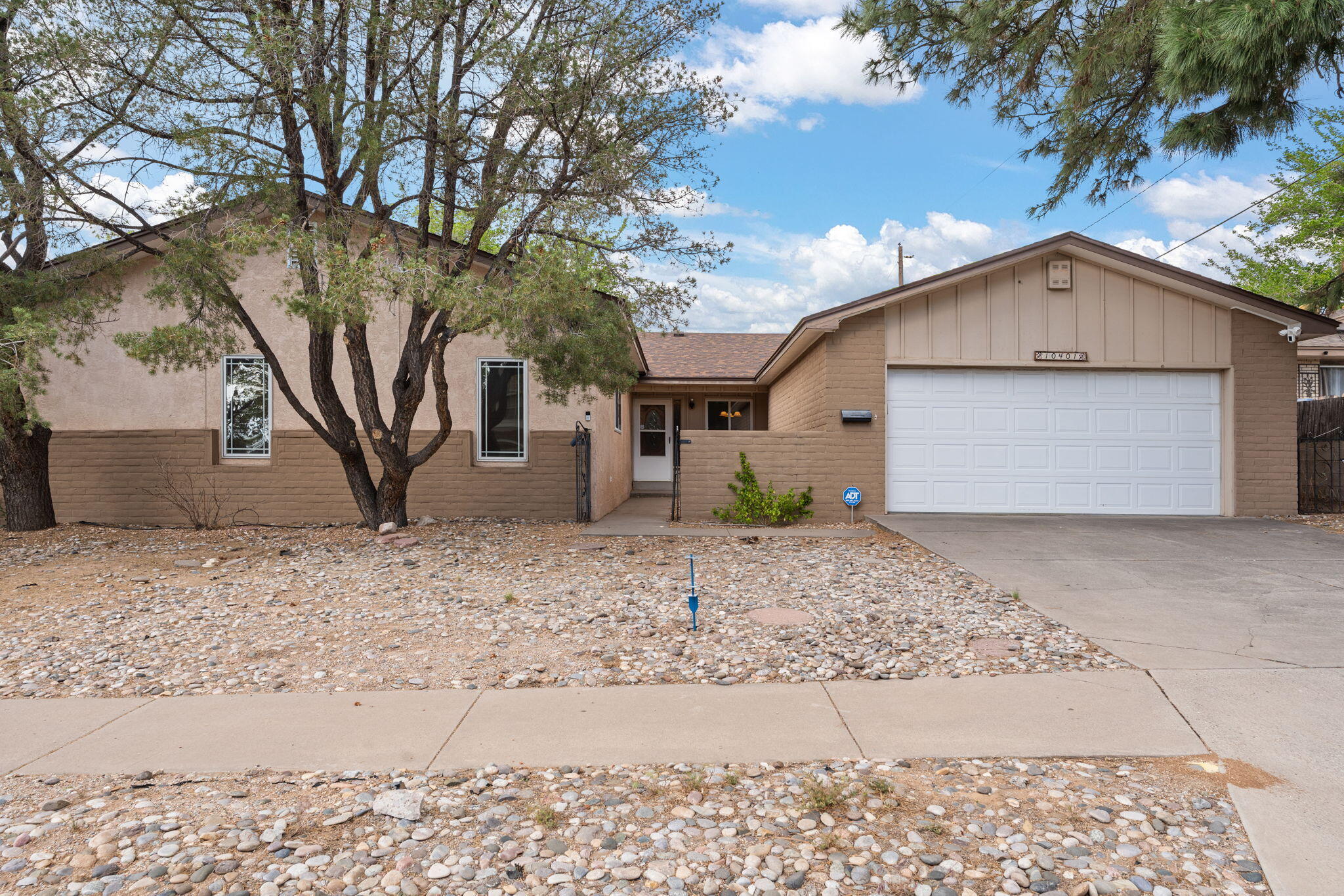 Beautifully maintained home featuring a new roof (2024), two water heaters (2021), and both evaporative and refrigerated air (2024). The open-concept layout is filled with natural light, creating a warm and inviting atmosphere throughout. Enjoy generous living spaces, a spacious kitchen, and a 2-car garage. Conveniently located near parks, schools, and shopping. Multi-family with mother in law suit. Move-in ready! Don't miss out on this opportunity, book your showing today!