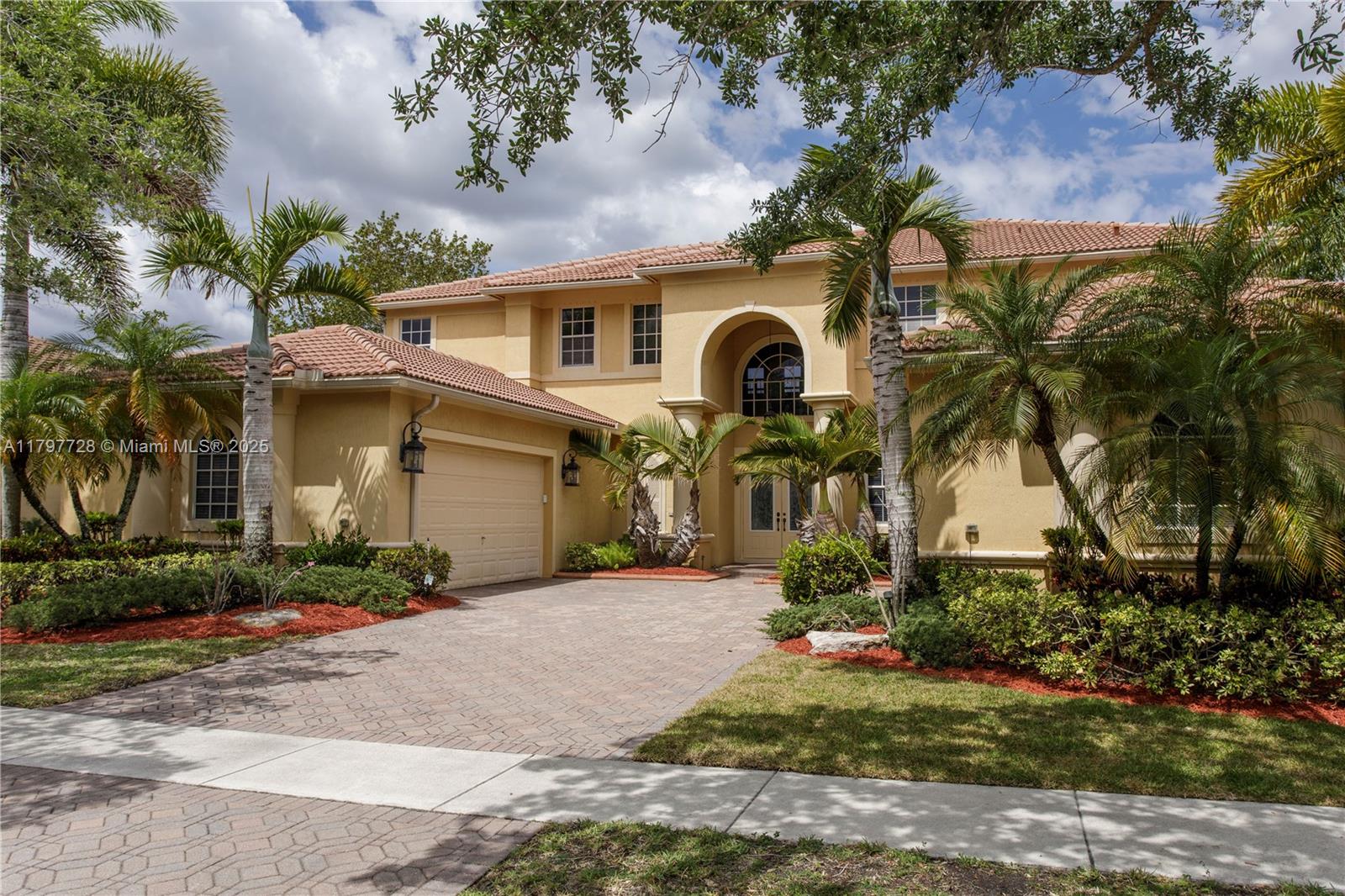 This STUNNING AND VERY SPACIOUS RESIDENCE features 6 BEDROOMS + OFFICE + LARGE LOFT, and a spectacular LAKE VIEWS. The kitchen features new appliances and ample storage space. Elegant marble floors on the first floor, along with high ceilings and large windows, fill the home with natural light.  Situated on an OVERSIZED LOT, this residence boasts an impressive two-story living room that opens through French doors to a covered patio with a NEW SUMMER KITCHEN — perfect for entertaining!  Ideally located in Isles at Weston, one of the city’s most desired gated communities, featuring a NEWLY RENOVATED CLUBHOUSE WITH GREAT AMENITIES. All within an A-RATED PUBLIC SCHOOL DISTRICT — offering the perfect blend of comfort, space, and location. Experience the best of the South Florida lifestyle!