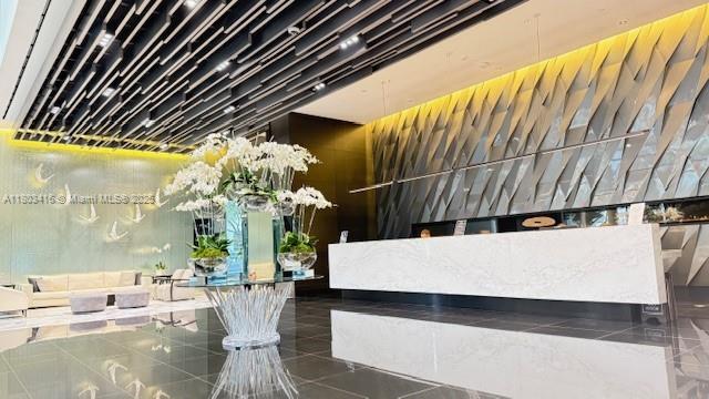 Beautifully 1/2 at the flagship building for Miami Worldcenter. Private elevator and private foyer invite you to this luxurious unit, in the building with the most amenities in the world.  The unit has been totally redone (spent $100K) as the all new bathrooms and showers, all new porcelain floors throughout, all new walls and custom made closets. Big corner balcony with new floors too. It ready to move in, and no one was lived in after renovation. Unit is vacant and empty and easy to show.