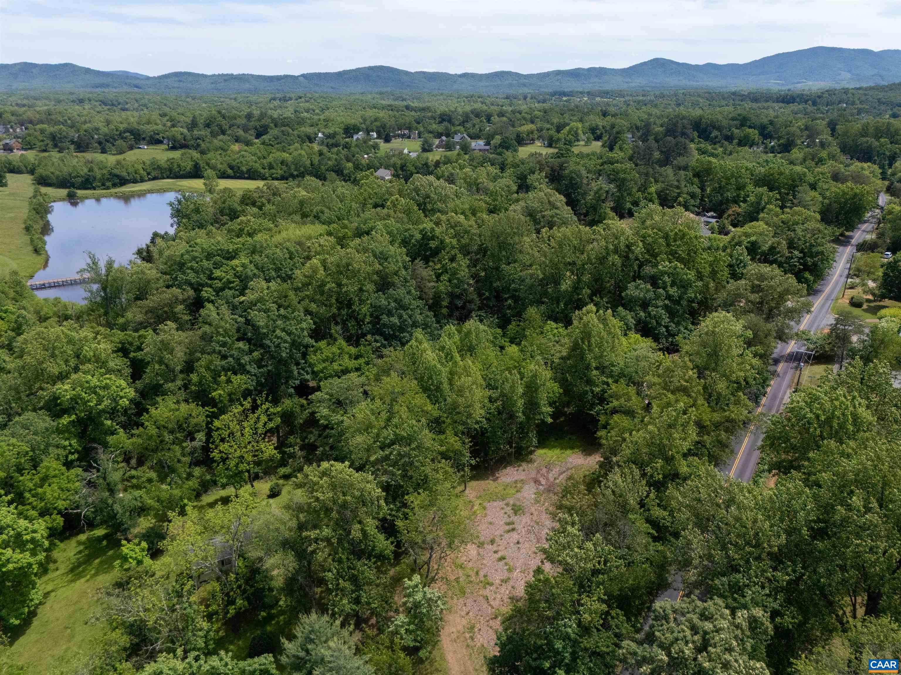 Prime location on this Western Albemarle 2.97 acre parcel tucked off Half Mile Branch RD just outside downtown Crozet in the Yancey Mills area. The site has mature trees offering privacy and with selective thinning can regain access to  western mountain views and to the adjacent Old Trail Golf pond. Close to King Family Vineyard and Roseland Polo and within easy access to Charlottesville and UVA, to local public schools, and to scenic drives along the Blue Ridge Parkway. No HOA and approved septic for 4-Bedroom.