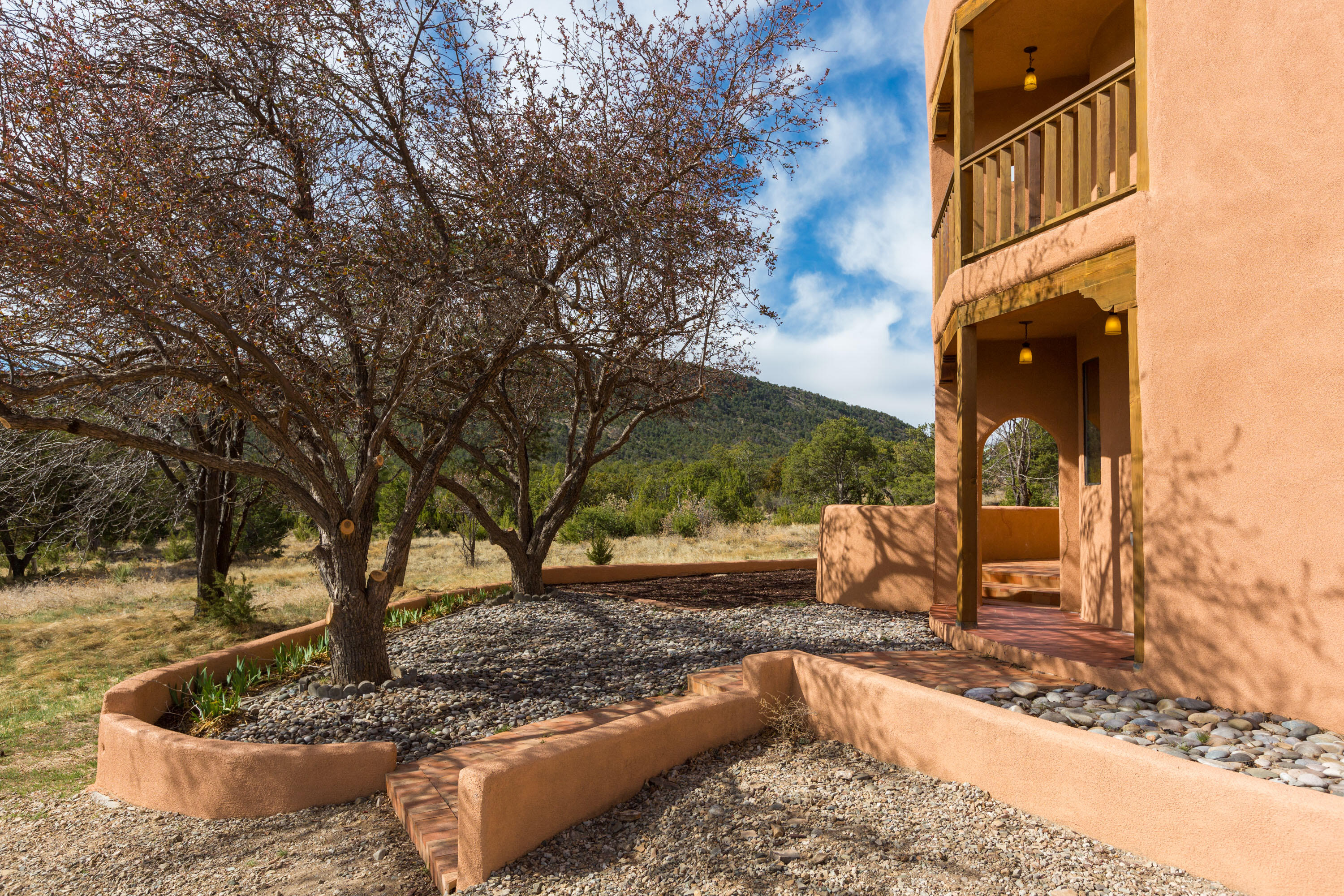 HUGE PRICE REDUCTION! OVER 8 ACRES! This stunning home offers 4 bedrooms, 3 bathrooms, and a generous 3183 square feet of exquisite living space. Revel in the beauty of the magnificent views from the floor-to-ceiling windows in the sunroom, creating a seamless connection with nature. The property spans an impressive 8.32 acres, providing an unparalleled sense of privacy as it backs to open space and is nestled at the end of a road. Embrace an eco-friendly lifestyle with the home's solar features and enjoy the comfort of 4 zone radiant heating. Hardwood flooring on main level, adds a touch of elegance , complementing the serenity and functionality of this remarkable house. Don't miss the chance to own this unique blend of luxury and sustainability--schedule your tour today