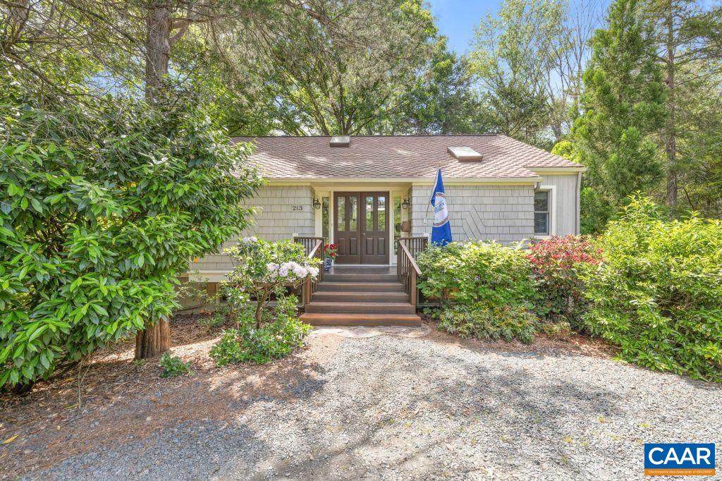 Peacock Hill, 15 minutes from UVA, is surrounded by farms w/ epic views of the Ragged Mtns and Blue Ridge. Enjoy nature at its best, a lake for fishing & paddling, playground, recycling center, tennis courts, miles of walking trails & Murray Elementary. Designed for seamless indoor-outdoor living, high ceilings, Low-e windows & skylights to bring the outside in. 2 fireplaces, lovely open kitchen for entertaining w/ custom maple cabinetry. Primary bedroom w/ en suite on the main level. Garden level has windows on all 4 sides. Sunsets & seasonal mtn views from all bedrooms and living spaces, nestled among healthy native VA flora & birds galore. Enjoy your own private oasis in a beautiful caring community.