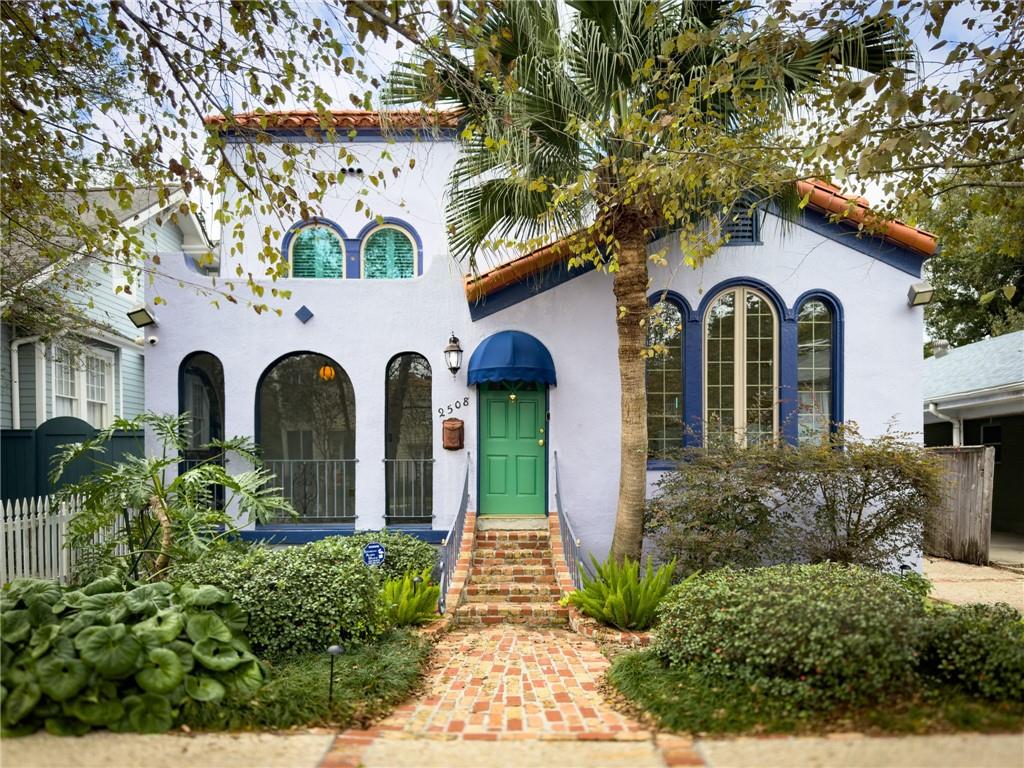 Century old Spanish Mission Revival in Uptown New Orleans, conveniently close to lower schools, Loyola & Tulane, and thriving Freret St - offering a variety of bars, restaurants & nightlife. The charming architectural details are naturally showcased throughout the home, from the cathedral arched ceilings in the formal living and dining rooms, and arched doorways and windows, to the plaster walls, and period fireplace. The centrally located kitchen features granite countertops, kitchen-aid stainless appliances, including a 6-burner range, and then leads out to a large, entertaining-friendly back patio. Both upstairs suites offer renovated baths, while the cozy office features large window, wainscoting, and custom bookcases lining both sides. Ground level floor is accessible through house or a private outside entrance which opens to a large den, bedroom and utility area. Potential exists to be easily converted to an in-law suite. Durable TPO commercial roof installed in 2023 accented with deluxe Terra Cotta roofing tiles. Behind the scene bonuses include double pane windows, programmable thermostat, whole house generator, water filtration system with ionizer, updated alarm system with outdoor security cameras, backyard drainage system, front and backyard irrigation systems, landscape lighting, off street parking and large storage shed. Please call direct for more information and link for Video Walkthrough.