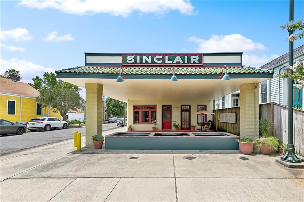 Imagine living in a piece of art in the Bayou St John neighborhood! Esteemed New Orleans artist, Robert Guthrie, created a modern marvel of living space. Built in 1918 and once a gas station, this iconic structure has been transformed into an architectural masterpiece. In deference to the building’s history, the original gas station exterior was kept intact with an expansive covered front area. Inside, you'll find soaring ceilings, an open floor plan reminiscent of a luxury loft, high end kit with all the desired appliances, upper BR fashioned from the original hydraulic lift, and 2 bath.  Only a creative artist could embellish cabinets with pulls made from car emblems and bathroom sconces made from car head lights! Whether you're a creative professional, an entrepreneur, or simply someone with an eye for the unique, this residence offers a canvas for self-expression. The rooftop terrace is the crown jewel—an expansive outdoor sanctuary that delivers panoramic views of the surrounding neighborhood, ideal for sunset cocktails, morning yoga, or simply soaking in the city's unmistakable ambiance. Set on a prominent corner lot in the heart of the Bayou St. John neighborhood, this home enjoys one of the most desirable and culturally rich locations in New Orleans. Just one block from the peaceful waters of the bayou, residents can enjoy scenic walks, kayaking, or relaxing beneath century-old oaks. A few steps more and you're at the Fair Grounds Race Course, home to the world-famous New Orleans Jazz & Heritage Festival—making this property not just a home, but a front-row seat to one of the city’s most celebrated annual events. City Park, with its botanical gardens, sculpture museum, and sprawling green spaces, is also just a short stroll away, as are countless beloved restaurants, cafés, and bars. This is more than a home, it’s a conversation piece, a work of art, and a gateway to the soul of New Orleans. This is an opportunity that rarely comes along!