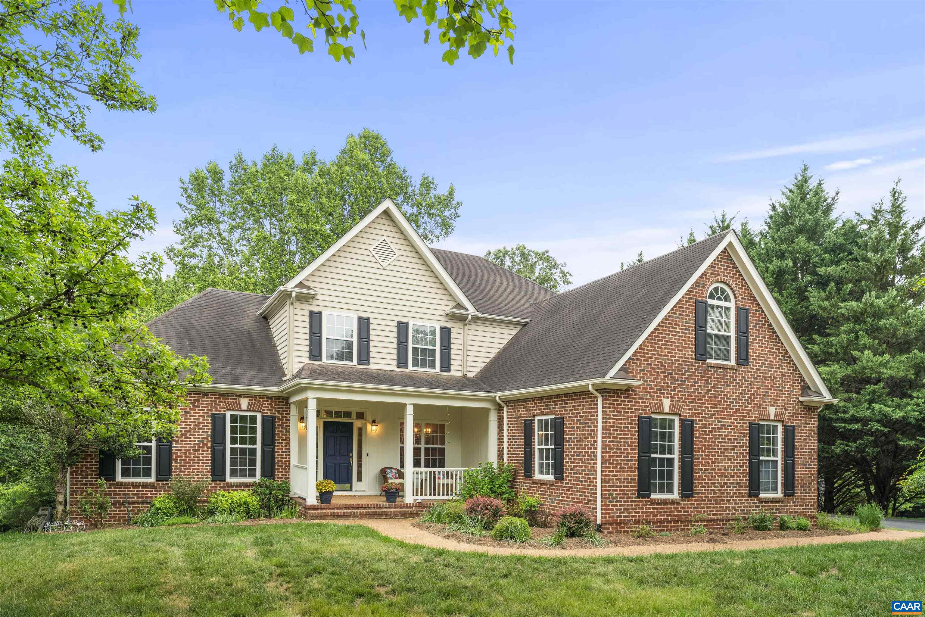 Spacious custom-built home with an open flowing main level living floor plan sitting on 2.7 acres backing to trees in Bentivar!  Step inside from a rocking chair front porch. Soaring two-story Great room with gas fireplace that opens to an eat-in kitchen with double ovens, glass cooktop and plenty of counter space plus sunny breakfast nook with two walls of windows. Main level primary suite with updated walk-in tile shower, separate vanities and tub plus generous walk-in closet. A dedicated home office or hobby room with custom built-ins, main-level laundry with mud sink and formal living & dining rooms complete the main floor. Upstairs, a spacious loft overlooks the Great room and leads to three additional bedrooms and two full baths. Walkout terrace level features a rec room, workout area, bedroom and full bath. Store your gardening tools in the mud room. Loads of storage throughout including a 56x13 unfinished space. Enjoy the outdoors on the elevated deck or patio below. Freshly painted main level in a neutral color pallet. Fabulous floor plan. New Metal Roof over front porch. Side load two-car garage. No HOA! Minutes to shopping, grocery & coffee. 1.5 mi to ACAC Fitness. 2.5 mi to outpatient care. 5 mi to CHO airport.