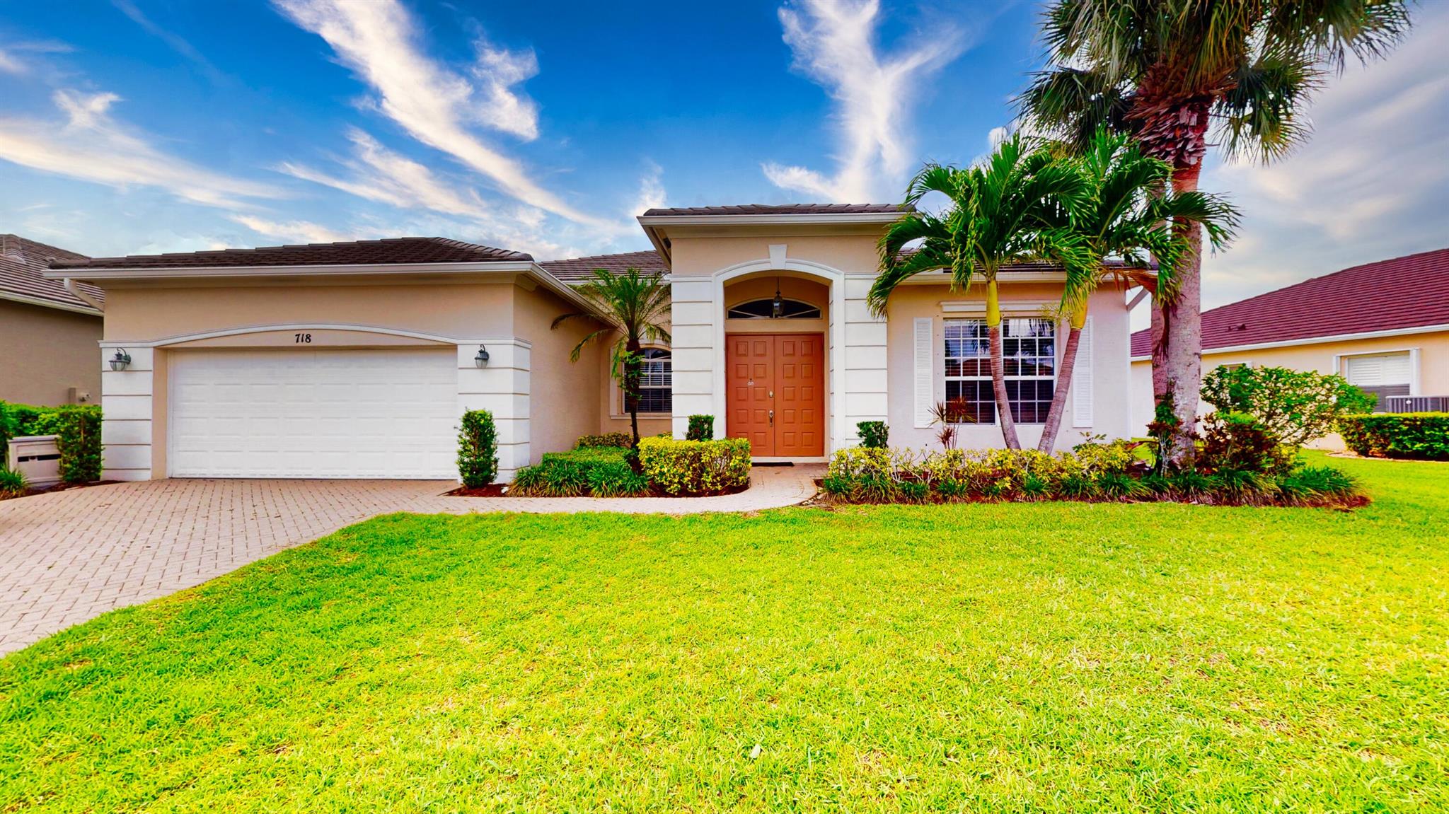 Nestled in the heart of the sought-after, family-friendly community of Lake Forest in Port Saint Lucie, 718 SW Myakka River Trace is a beautifully maintained 3-bedroom, 2-bathroom home with a versatile den and an inviting open floor plan. As you enter through elegant double entry doors, you're welcomed into a spacious layout that features a formal living and dining area, as well as a cozy family room perfectly positioned off the upgraded kitchen. The kitchen is a chef's delight, boasting 42-inch cabinets, stunning countertops, and a built-in shelved pantry that offers ample storage. The oversized master suite is a true retreat, complete with a large walk-in closet, dual sinks, a walk-in shower, and a relaxing soaking tub. Two additional guest bedrooms are located separately from the master, making them ideal for children's rooms or visiting family, with a full bathroom conveniently situated between them. The front den adds flexibility, perfect for a home office, playroom, or even a fourth bedroom. A tile roof adds charm and durability, while the serene preserve view provides a tranquil backdrop for everyday living. This home seamlessly blends comfort, function, and style in one of Port Saint Lucie's most desirable neighborhood