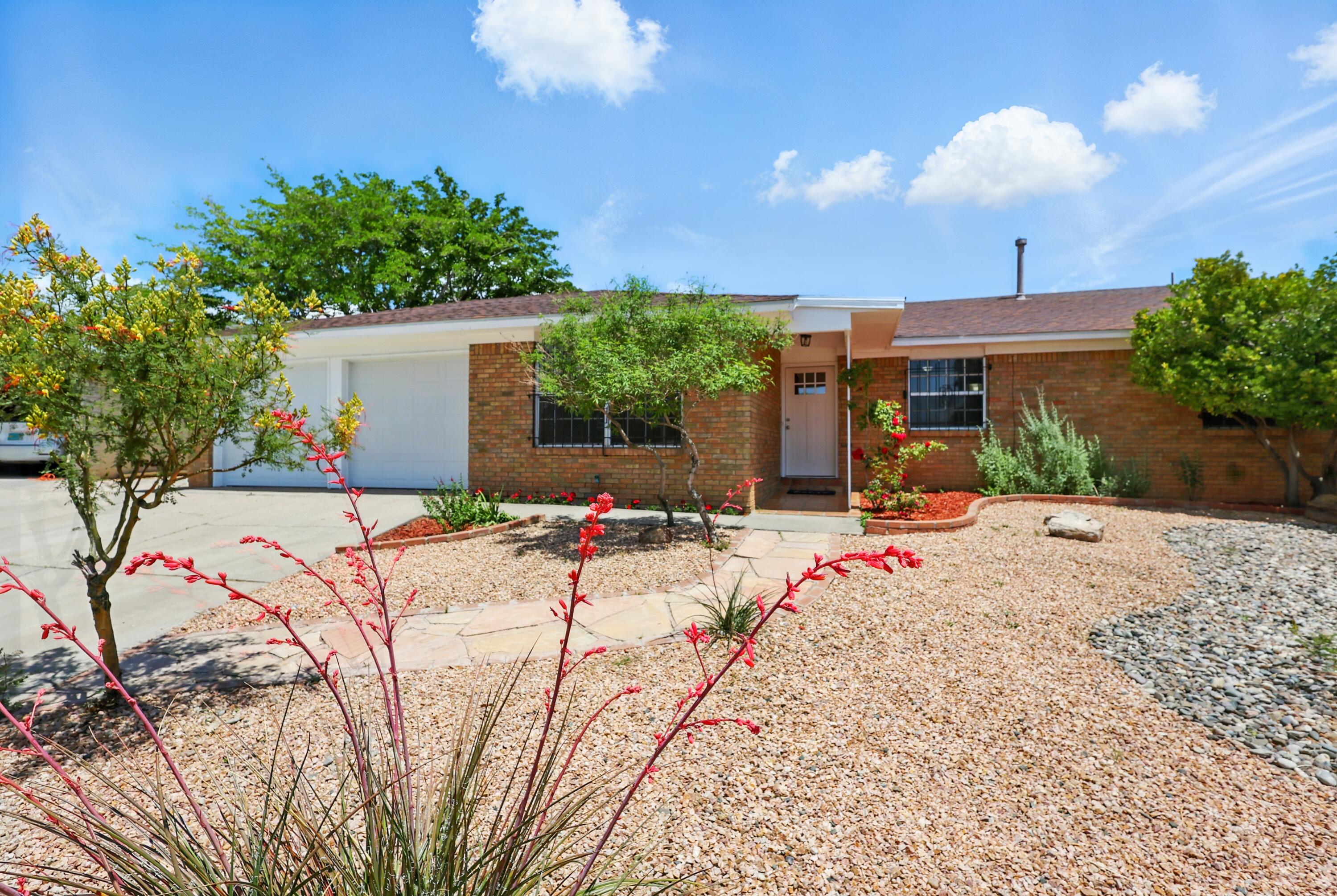 Welcome to this beautifully updated NE Heights home with a huge yard and lots of living space too. Located in a friendly cul-de-sac on an oversized 11,325.6 sqft lot with backyard access. Plenty of space for your animals, gardening, and entertaining. Updated kitchen and baths provide luxurious amenities while the classic Saltillo tile floors and wood burning fireplace add a touch of New Mexican charm. 4 large bedrooms plus a bonus room with a separate entrance. Serene backyard with large covered porch, mature fruit trees, and grape vines. Garage is heated/cooled and was converted to a living area on the interior only, it will be converted back to 2-car garage by closing. Located in a desirable area near great schools, shopping, and the beautiful Sandia Mountain Foothills.