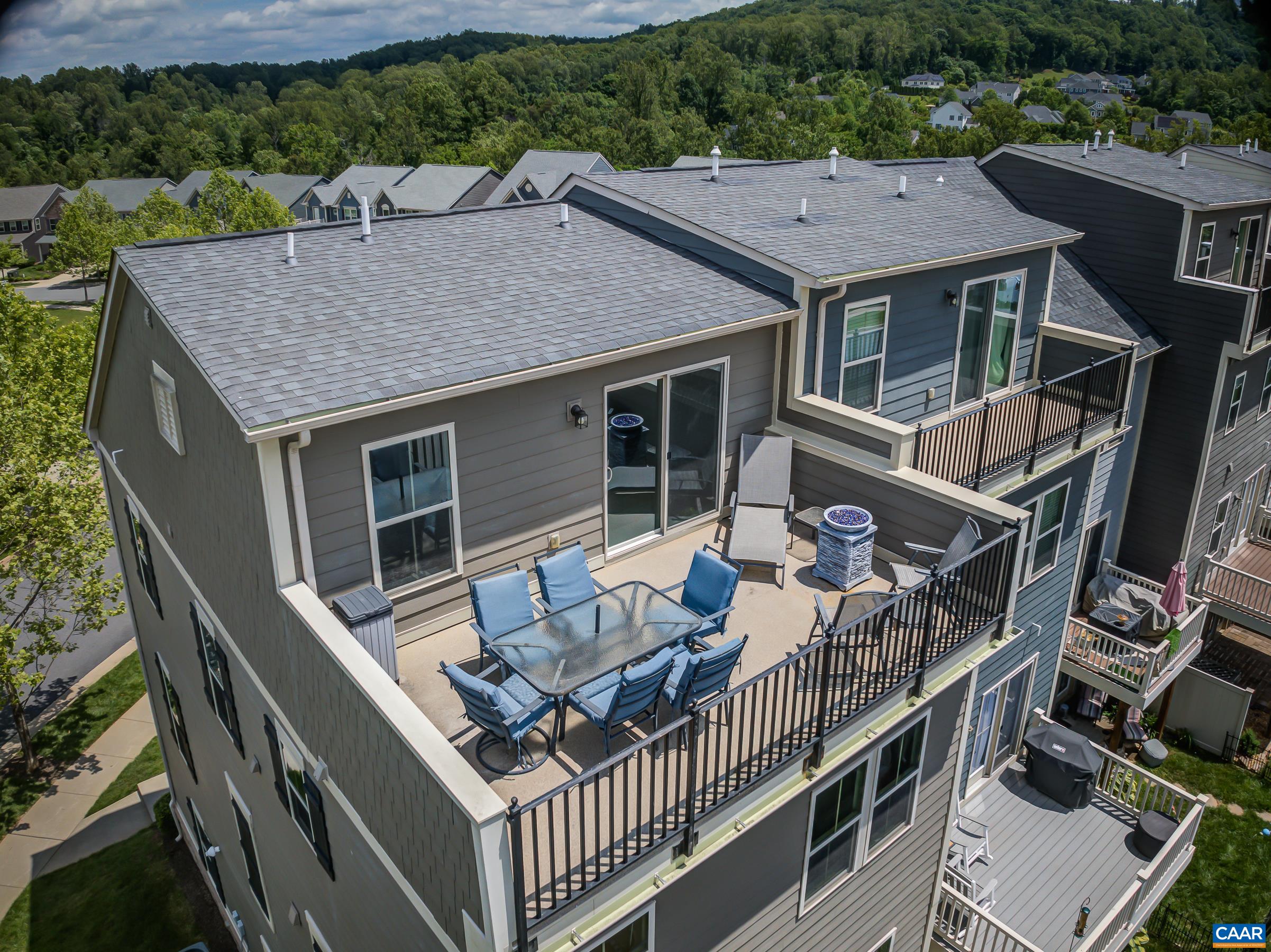 NEW PRICE!!  Immaculate home in super convenient location with roof top terrace views you'll LOVE.  Come see this beautiful end unit home with amazing, upgraded living spaces, finishes and spectacular city views from the rooftop terrace in Cascadia! This home features neutral tones with  custom window treatments and fans throughout! Ground level entrance level features LVT low maintenance flooring in the foyer, carpeted large rec room and home office/4th bedroom. Entertainers will love the open floor plan on the main level with a large open great room that flows into the modern kitchen, dining room and morning room. Kitchen features black cabinets, granite counters and island with seating, and stainless appliances. Bedroom level features owners and guest suites each with private bathroom. Owners suite features soaking tub and separate shower.  Top level features an additional bedroom/entertainment suite with expansive rooftop terrace. Detached two car garage features storage above, and pull down stairs to the floored attic offer storage too! Enjoy the outdoors on the composite deck, or ground level patio, and don't miss the rooftop view!