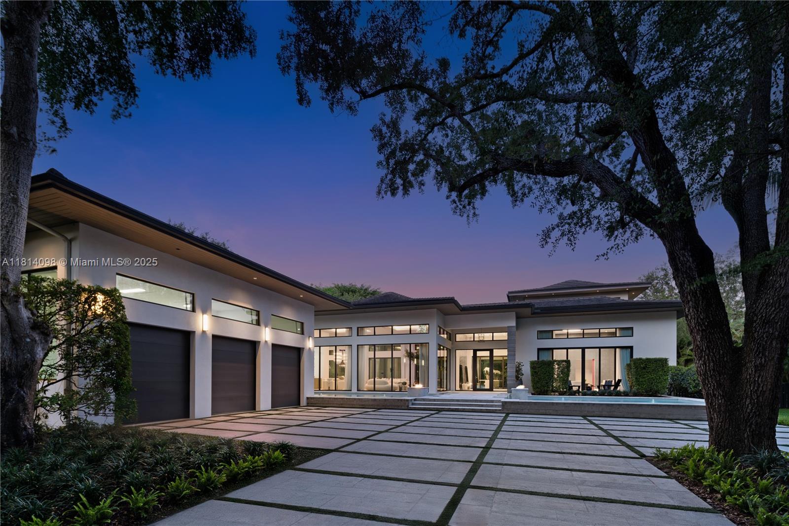 Custom N. Pinecrest 2019 build, that exudes modern style, family functionality and a lounge that is sure to impress any sports enthusiast. Sitting on an acre+, drive thru the gated entry and be greeted to fire and water features. Stunning open floor plan that showcases the Officine Gullo kitchen, walk-in pantry and wall-to-wall glass to overlook your own tropical paradise backyard. Pool/Spa and covered terraces with summer kitchen. 4 Bedrooms upstairs, each connecting to its own sitting area on the first level. Luxe primary suite w/boutique closet, spa bath, floating tub, and 16-ft shower. Home theatre with comfy recliners and wet bar, Sports Lounge with 9-screens and full bar, Elevator, maid’s ste, generator, 3-car gar. This home has it all, and is located near the top schools in Miami.