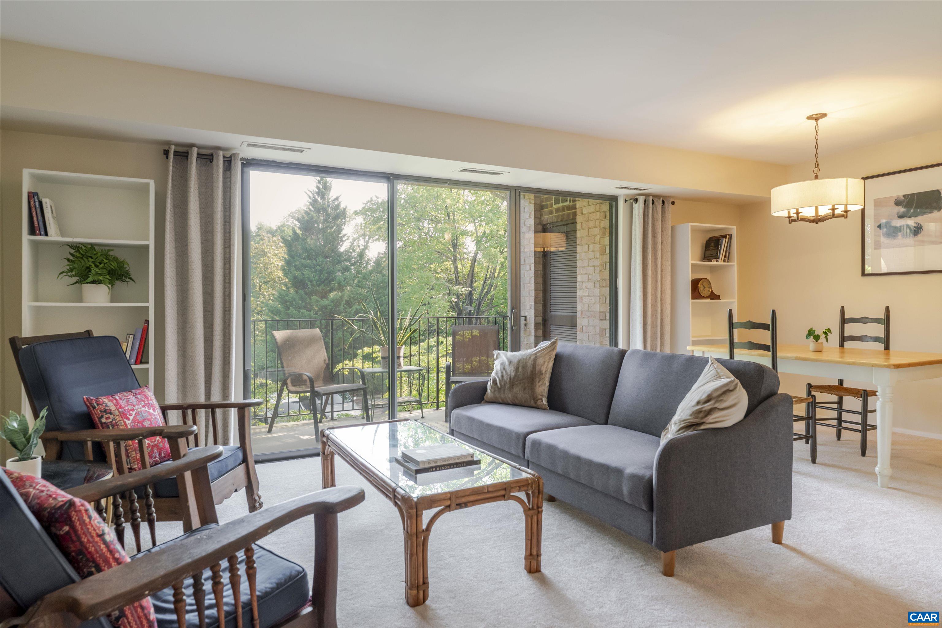 Price update! Super convenient updated North Downtown 1 BR / 1 BA condo on quiet historic street just four blocks from the Downtown Mall restaurants and shops. Easy to view! Large sliding glass door and windows to 4th floor covered balcony with beautiful view of mature oak trees surrounding the property. Modern kitchen has stainless appliances and gas range. Spacious living area allows for flexibility and home office space. Plenty of wall area for art and bookshelves. The bedroom features two generous closets. Overflow storage is available for lease in the basement as well. Secure lobby entry with elevator. Plenty of parking. COA fee includes all utilities except cable/internet. Building has been recently updated with renovated entry, hallways, and new laundry room. Move in ready!