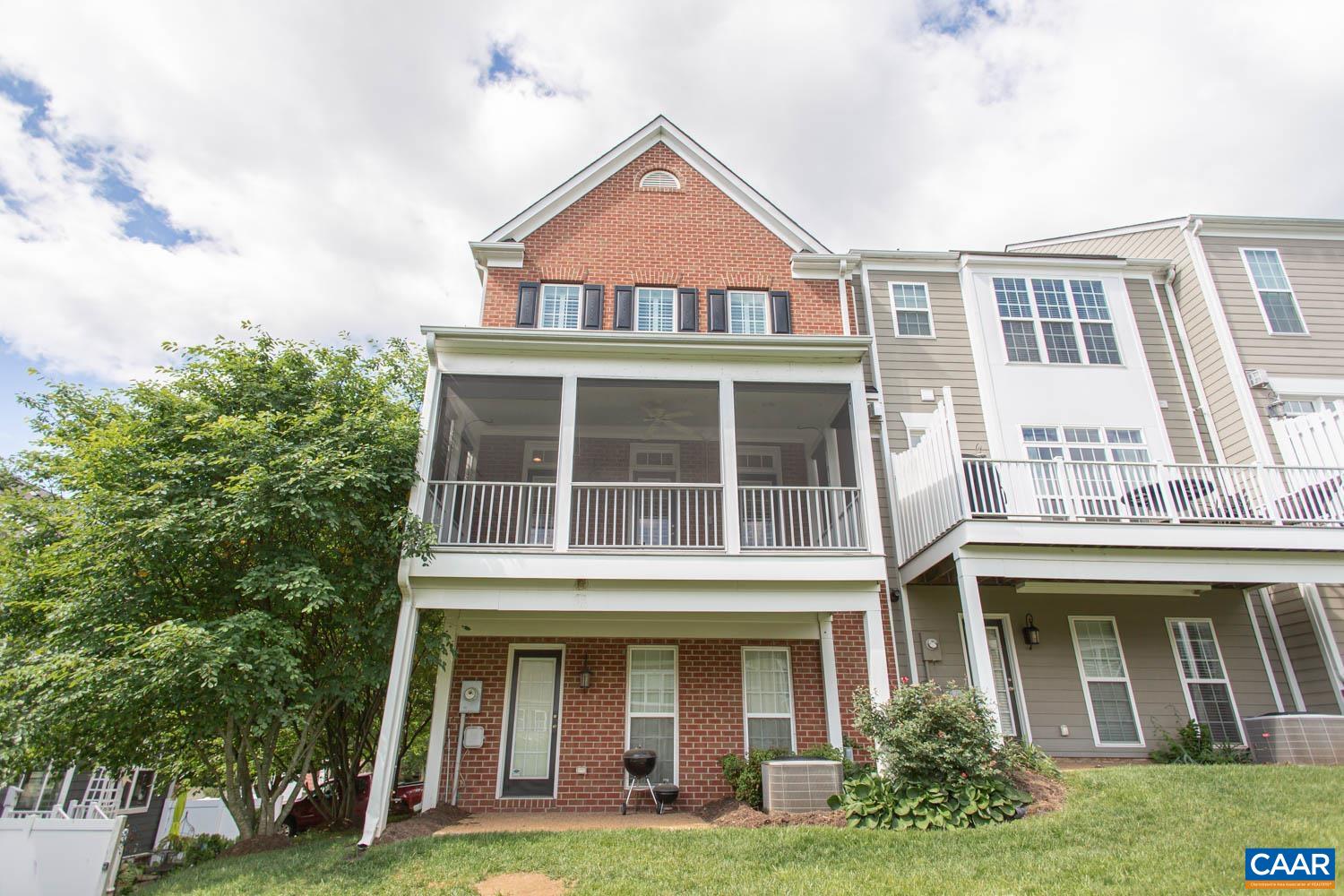 This beautiful end-unit townhome is full of custom upgrades from the louvered windows throughout the home to the tray ceilings in the dining room and primary bedroom. Enter the spacious foyer & up the stairs to the main level where you’ll find the kitchen with granite counters & stainless steel appliances including a gas cooktop & wall oven. Gleaming hardwood floors throughout the bright, spacious formal dining room and living room which includes a gas fireplace & access to the screened porch with solar shades overlooking the community green space. Upstairs, you’ll find a generous bedroom with large closet, built-in shelving, & attached bath. Through the double-doors is the primary suite with a walk-in closet & attached bath including dual vanities & tiled shower. Convenient laundry closet in the hallway. The lower level has a generous third bedroom/family room with attached full bath & entrance to the backyard. Located in the popular Avinity development just minutes from 5th Street Station, shopping, dining, wineries, & more!