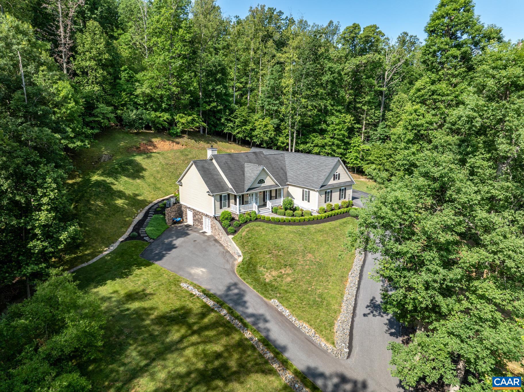 You will Love this home in North Garden with an ELEVATOR, and this one is accessible to all floors by wheelchair or scooter, and the design allows for a disabled person to have features to allow more independence! In terms of location, this property offers rural tranquility without compromising on accessibility. It's just a short 15-minute drive from The University of Virginia and close to Charlottesville VA. Southern Albemarle County, where the home is located, is known for its local vineyards and cideries.  this spacious 4,417 sq ft home sits on a private 2-acre lot with breathtaking views. The elevated position of the property enhances its natural charm and appeal. The home features three bedrooms and three bathrooms. The primary bedroom and bath on the main level also has a special tub for easy transfer from a mobility device. The rear patio provides absolute privacy and quiet living! Lower level can be for a companion or guest quarters and there is tons of storage. Mature landscaping, lots of special features - Generac generator works for main floor only. There is a special air filtration system, instant hot water heat, central vac system in most of the rooms and more!