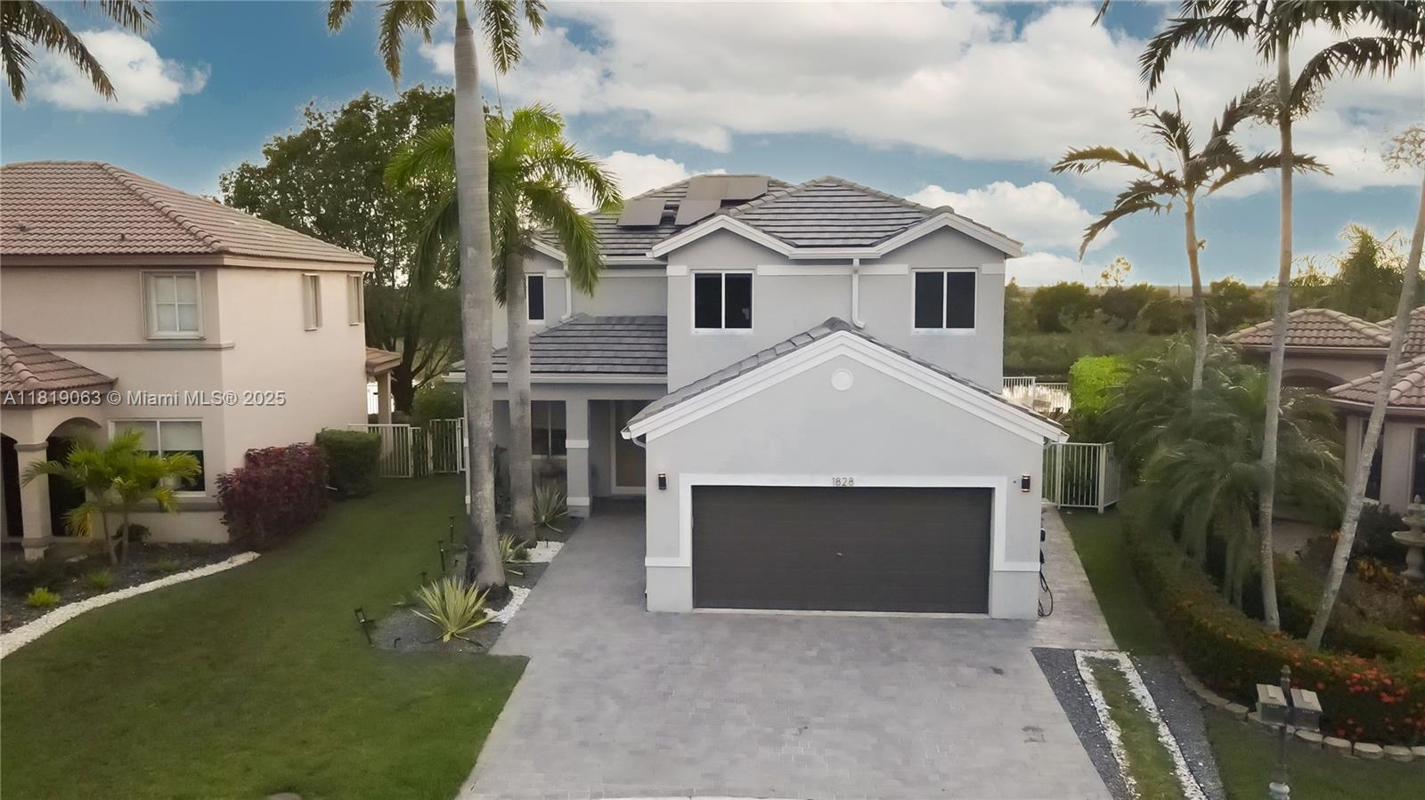 Fully renovated luxury home in Savanna. This waterfront 5 bed, 4.5 bath home features a smart layout, custom high-end finishes, and over $200K in custom carpentry. Highlights include a gourmet kitchen with smart appliances, wine bar, floating metal & wood staircase, new porcelain & waterproof vinyl floors, custom closets, new roof, impact windows, and 20-ft sliding doors for seamless indoor-outdoor living. Enjoy stunning lake views, heated smart pool & spa, outdoor kitchen with Argentinian BBQ, gas & wood pizza oven, new full bath, gym, EV charger, owned solar panels, tankless water heater, 200-amp underground electric service, Cat-5 wiring throughout, and expanded paver driveway. A perfect blend of elegance, technology, and resort-style outdoor living in Weston’s most desirable community.