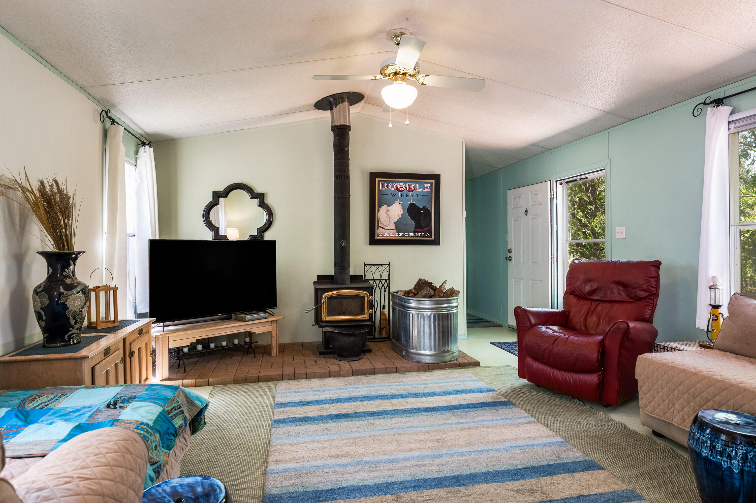 Enjoy cool pines & privacy in the Manzano Mtns,  close to ABQ! Furnished/remodeled  Mobile Home on two-5AC lots! Live in the MH & build on the 2nd Lot OR use the Property as a Summer ''Camp'',  winterize, come back next year to enjoy!  Property stays safe & secure! Includes a 40 ft Shipping Container, 1000g buried water tank, 1000g concrete liquid waste tank & the cutest outhouse in the west! (saves water) The 3bdr MH includes a large Primary suite w/updated bath, cozy living, dining & kitchen area w/a Woodstove. Furnished tastefully w/TVs, beds, linens, full kitchen & much more.  Starlink Dish, washer/dryer combo, refrigerator, stove & microwave, portable A/C & ceiling fans. Outside pergola w/ brick patio, hammock, tire swing, etc.  The perfect mountain getaway!