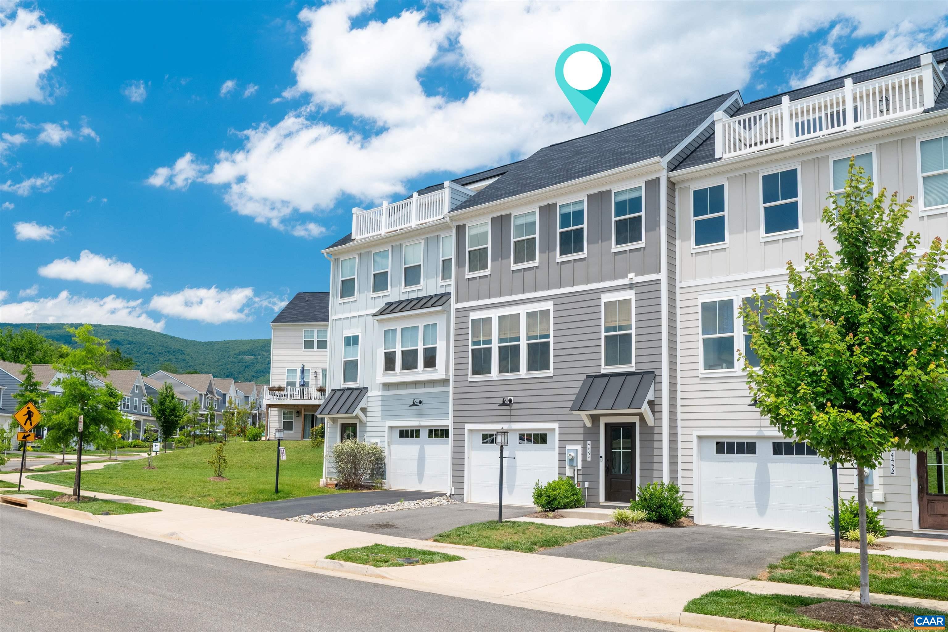 This lovely townhome in sought after Pleasant Green has it all! And just a short walk to downtown Crozet’s coffee shops, bakery, restaurants, shopping & library. This home is a must see with so many upgrades! The main living space (on the 2nd level) is a light filled open floor plan and features a modern gourmet kitchen perfect for entertaining, with a huge island, high-end stainless appliances, Quartz countertops, upgraded cabinetry and opens to the spacious low maintenance deck. The 1st level space offers lots of options; a family or play room, an office, a home gym or guest bedroom. The one-car garage has storage space and an EV charger. The 3rd level is where you will find the primary bedroom suite w/ a beautiful upgraded private bath w/ double vanity and fully tiled walk-in shower, two additional bedrooms, 2nd full bath & laundry. Energy efficiency and great sound insulation between homes. Neighborhood amenities include; playground, club house, fire pit, grills and basketball court.