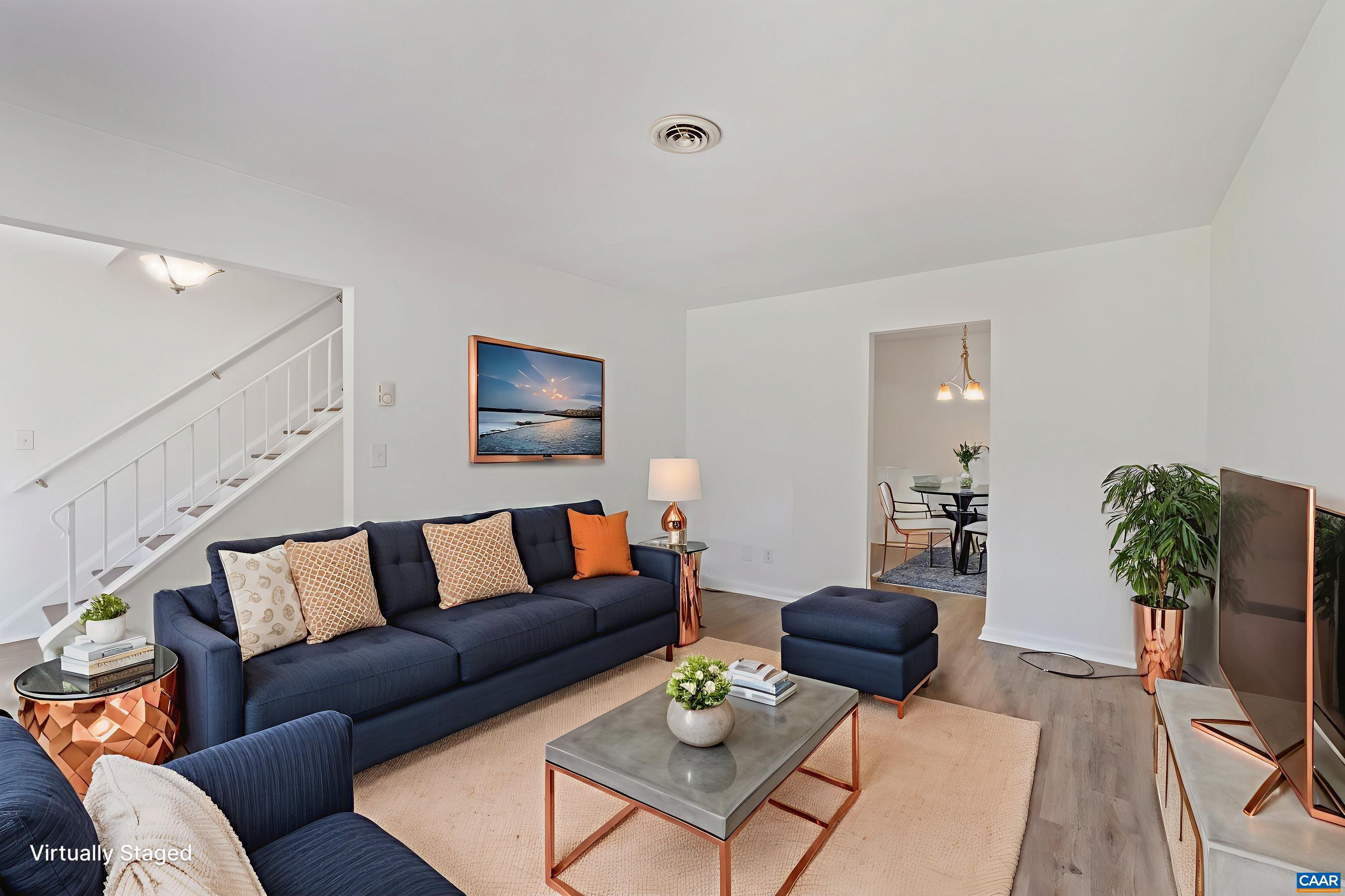 Perfect for On-the-Go Professionals! This beautiful move-in ready 3BR/1BA/2HB end-unit townhome offers fresh updates, refinished hardwood floors, and low-maintenance living—all just minutes from UVA, Downtown Cville, Wegmans & I-64. Enjoy a bright living space, eat-in kitchen, private patio, and two assigned parking spots. Quick commute, easy travel, and stylish comfort—ideal for busy professionals who need a convenient home base.  Step out from the kitchen to a concrete patio, ideal for BBQs and outdoor dining.  Turnkey. Convenient. Central.